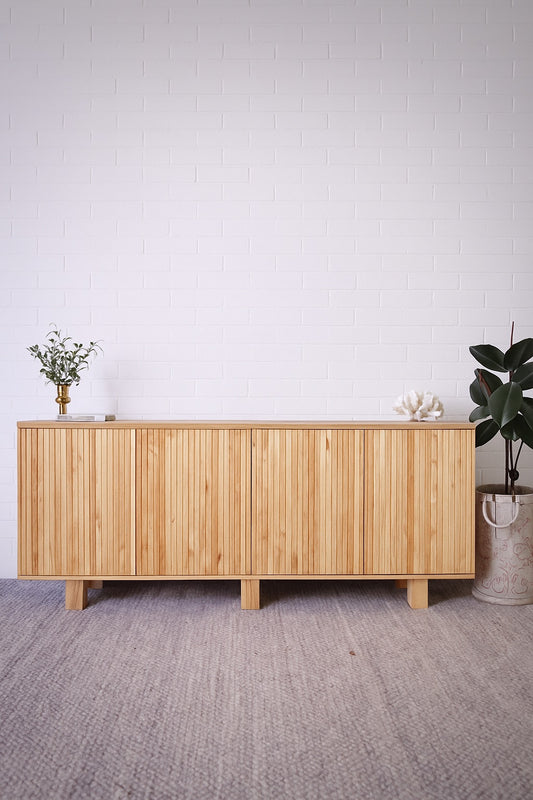 The Florence Natural Buffet. 4 textured doors with smart storage behind the left door featuring 4 drawers. Colour Natural. Measures 1800 wide X 400 depth x 900 height. Styled.
