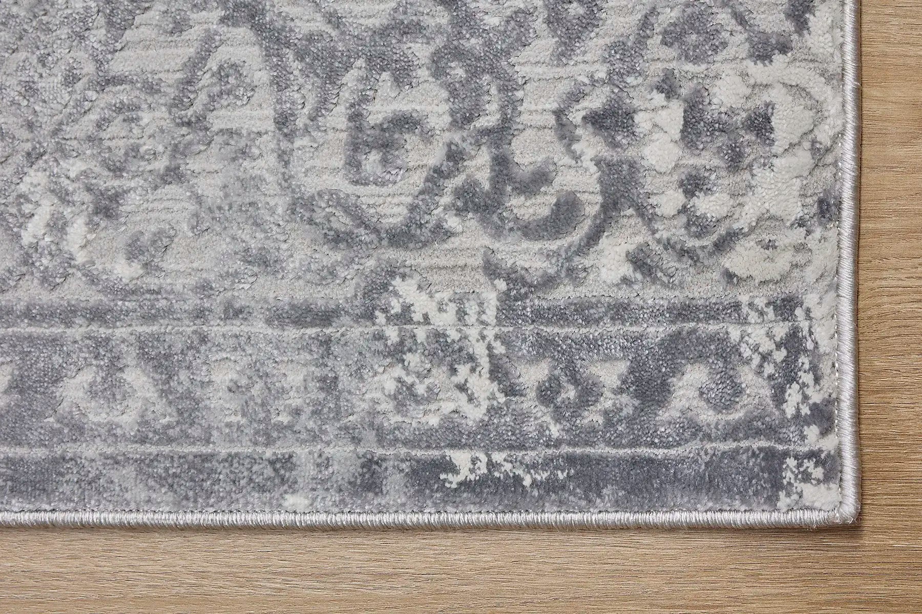 France Grey is a machine made rug. Its design boasts a traditional floral feel. Crafted from Polyester, with a low-profile 7-9mm pile height. Colours Light  Grey and Grey tones. Sizes 160 X 230, 200 X 290, 240 X 340 and 300 X 400. Corner.