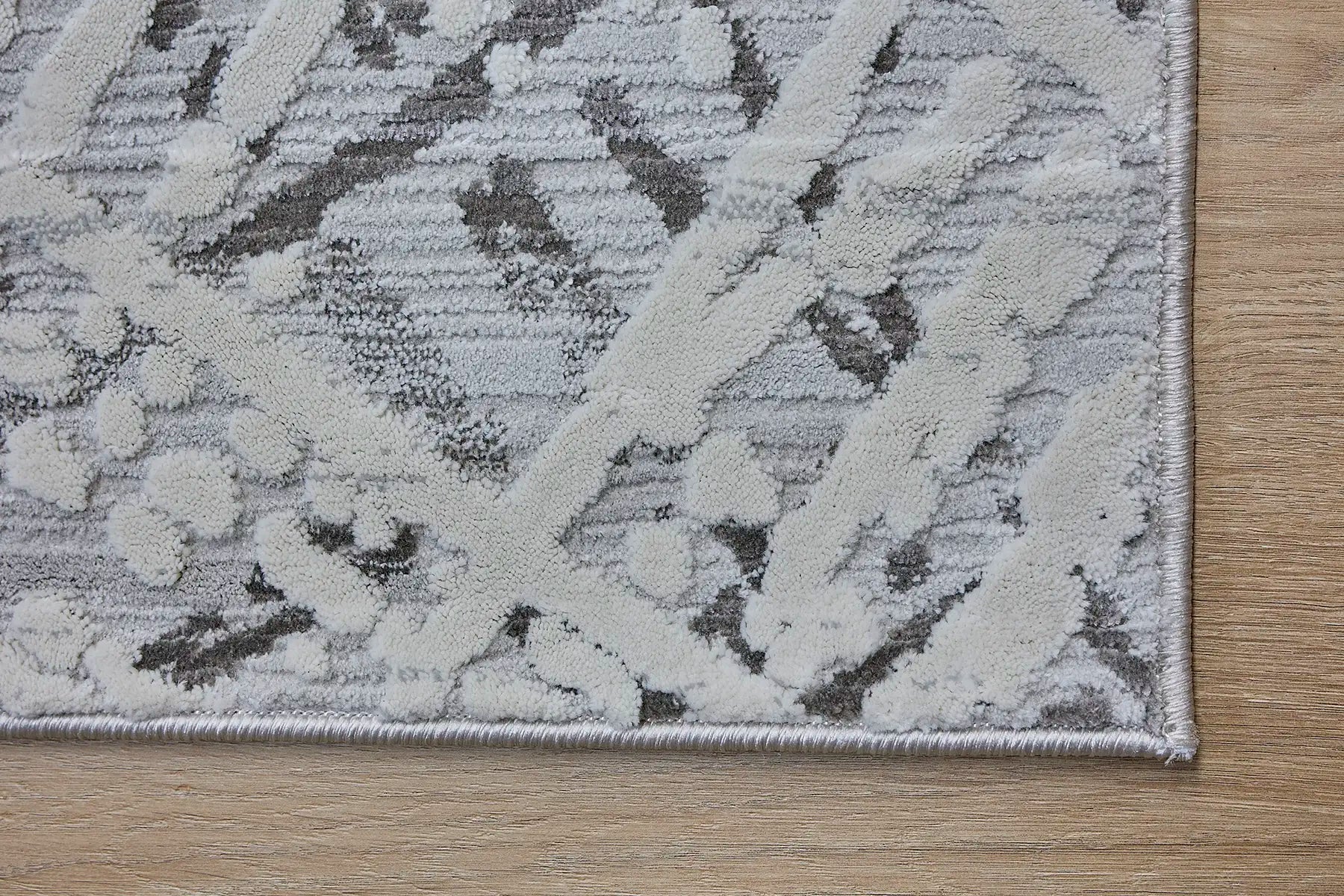 France Latte is a machine made rug. Its design boasts a abstract modern/contemporary feel. Crafted from Polyester, with a low-profile 7-9mm pile height. Colours, Light Grey and Grey tones. Sizes 160 X 230, 200 X 290, 240 X 340 and 300 X 400. Corner.