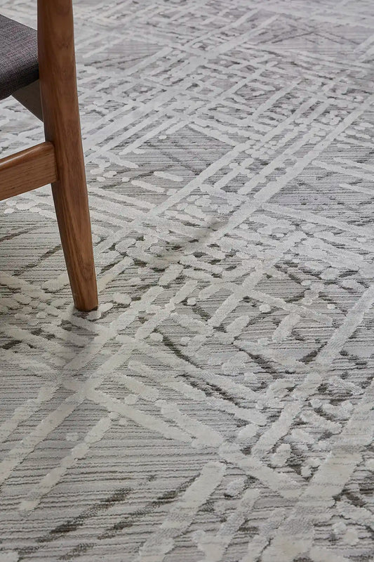 France Latte is a machine made rug. Its design boasts a abstract modern/contemporary feel. Crafted from Polyester, with a low-profile 7-9mm pile height. Colours, Light Grey and Grey tones. Sizes 160 X 230, 200 X 290, 240 X 340 and 300 X 400. Life.