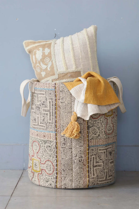 The Frosted Art Cotton Block Print Basket featuring a bold block print design and sturdy handles. Features a cotton liner and texture cotton outer shell. Colours, creams, browns, oranges, light blues. Measures 400 height X 350 diameter. Front Styled.