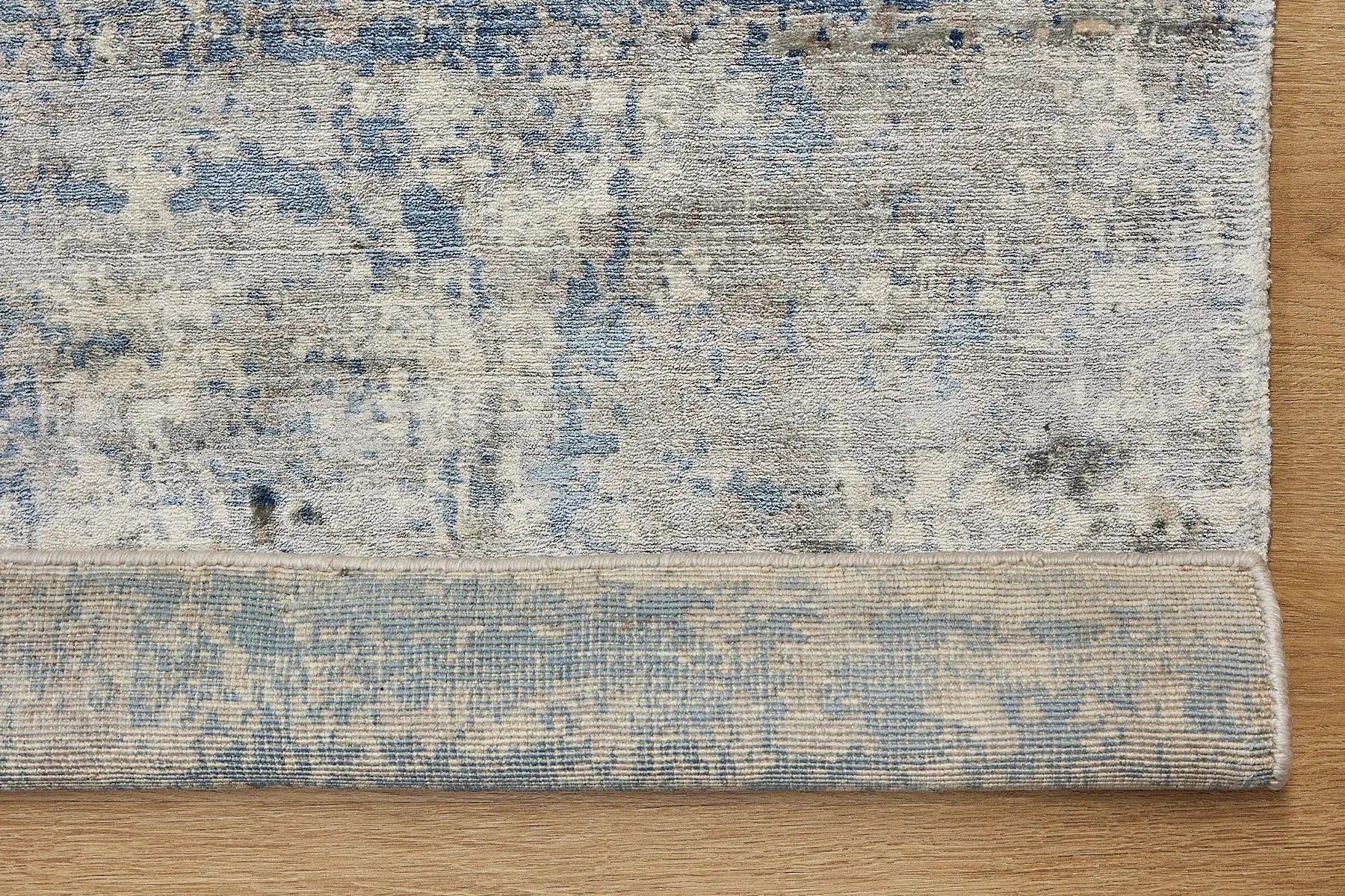 Fusion Blue is a handcrafted rug made of luxurious bamboo silk and viscose. It features a textured, intricate, and opulent weave with a pile height of 12-14mm. Colours Blue and Grey Blend. Sizes 160 X 230, 200 X 290 and 240 X 340. Fold.