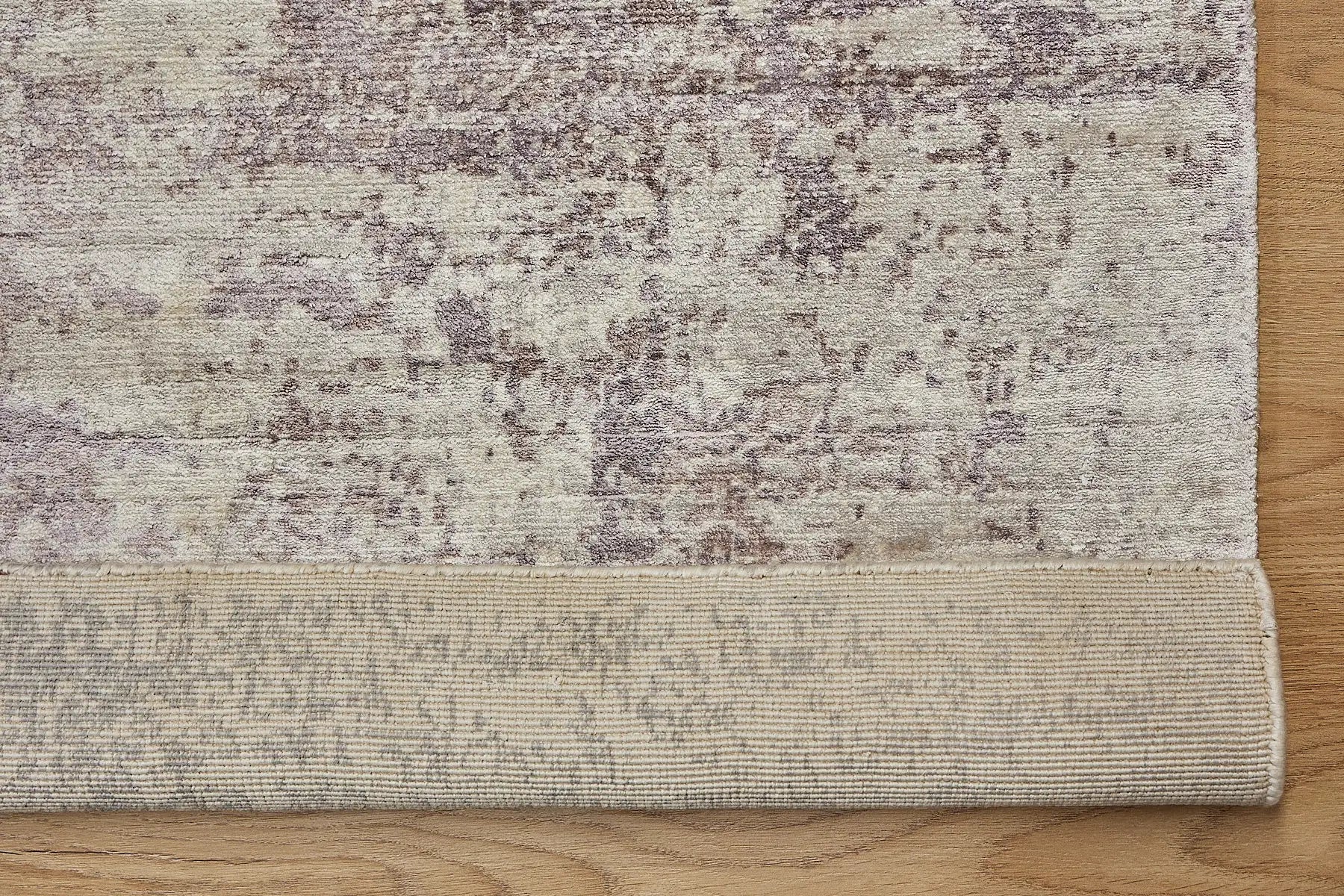 Fusion Lilac is a handcrafted rug made of luxurious bamboo silk and viscose. It features a textured, intricate, and opulent weave with a pile height of 12-14mm. Colours Cream, Beige and Lavender Blend. Sizes 160 X 230, 200 X 290 and 240 X 340. Fold.