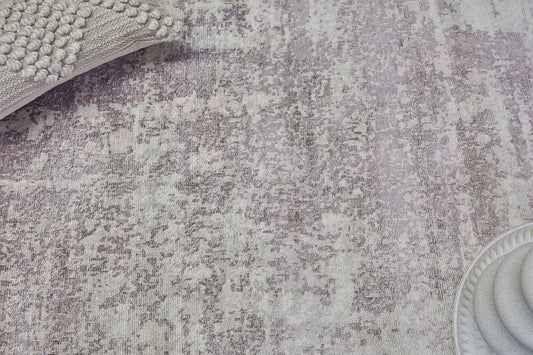 Fusion Lilac is a handcrafted rug made of luxurious bamboo silk and viscose. It features a textured, intricate, and opulent weave with a pile height of 12-14mm. Colours Cream, Beige and Lavender Blend. Sizes 160 X 230, 200 X 290 and 240 X 340. Life.