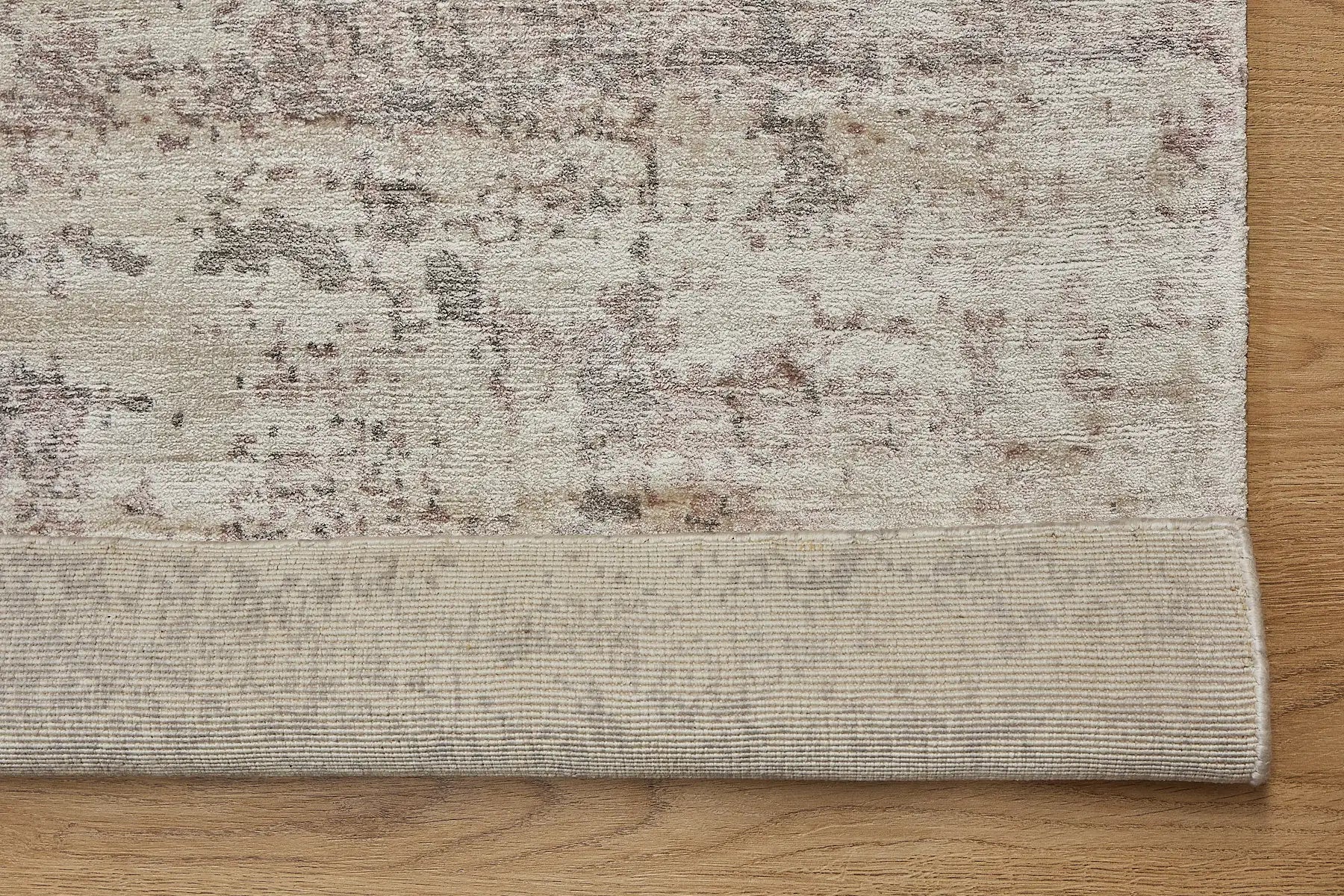 Fusion Taupe is a handcrafted rug made of luxurious bamboo silk and viscose. It features a textured, intricate, and opulent weave with a pile height of 12-14mm. Colours Grey, Light Grey and Beige Blend. Sizes 160 X 230, 200 X 290 and 240 X 340. Fold.