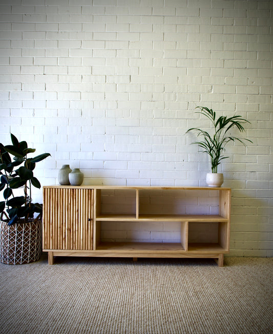 The Gemini 1 Door bookshelf is a contemporary stylish piece. It is crafted from white cedar and features multiple shelves and a single textured door. Colour natural. Measures 1650 length X 350 depth X 700 height. Front Styled.
