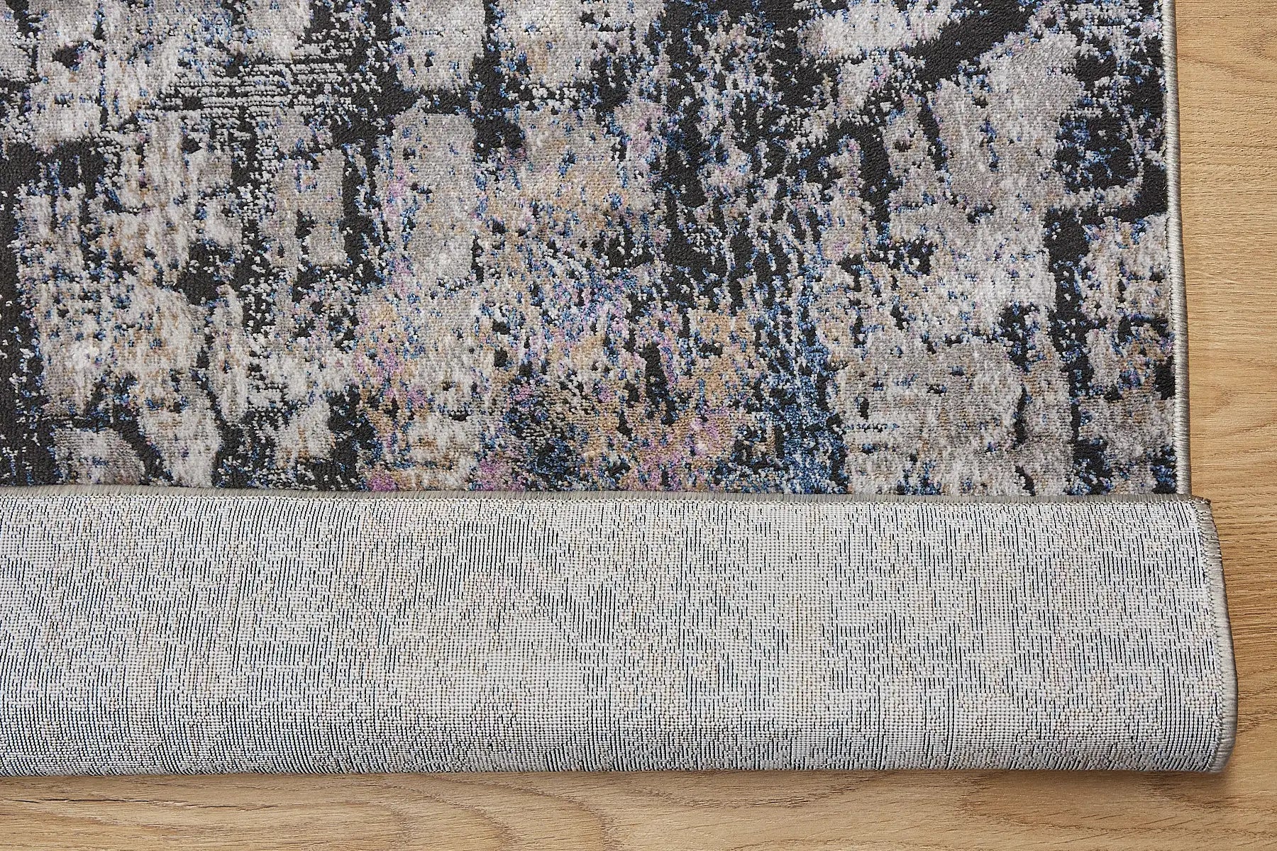 Geneva Black is a machine made rug. Its design boasts a modern/contemporary feel. Crafted from Viscose and Polyester, with a low-profile 7-9mm pile height. Colours Light Grey, Black and Blue accent tones. Sizes 160 X 230, 200 X 290 and 240 X 340. Fold.