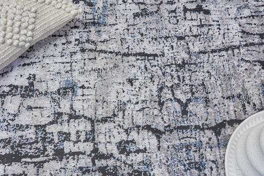 Geneva Black is a machine made rug. Its design boasts a modern/contemporary feel. Crafted from Viscose and Polyester, with a low-profile 7-9mm pile height. Colours Light Grey, Black and Blue accent tones. Sizes 160 X 230, 200 X 290 and 240 X 340. Life.