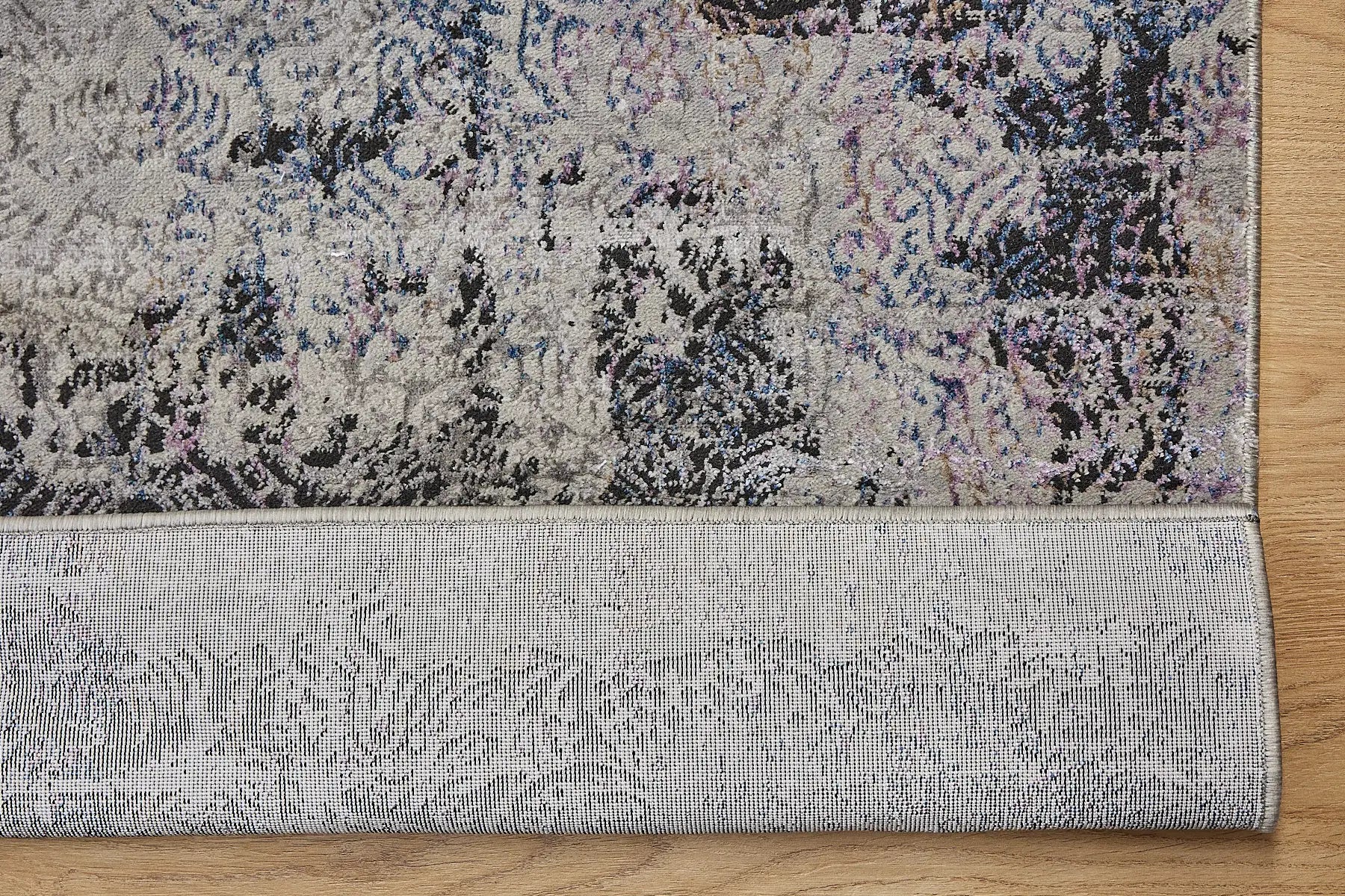 Geneva Grey is a machine made rug. Its design boasts a abstract modern/contemporary feel. Crafted from Viscose and Polyester, with a low-profile 7-9mm pile height. Colours Light Grey with Blue and Black accent tones. Sizes 160 X 230, 200 X 290 and 240 X 340. Fold.