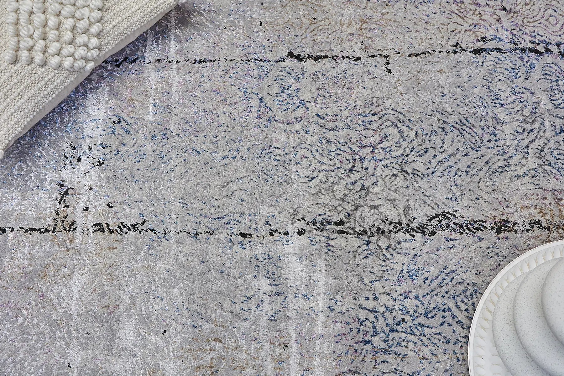 Geneva Grey is a machine made rug. Its design boasts a abstract modern/contemporary feel. Crafted from Viscose and Polyester, with a low-profile 7-9mm pile height. Colours Light Grey with Blue and Black accent tones. Sizes 160 X 230, 200 X 290 and 240 X 340. Life.