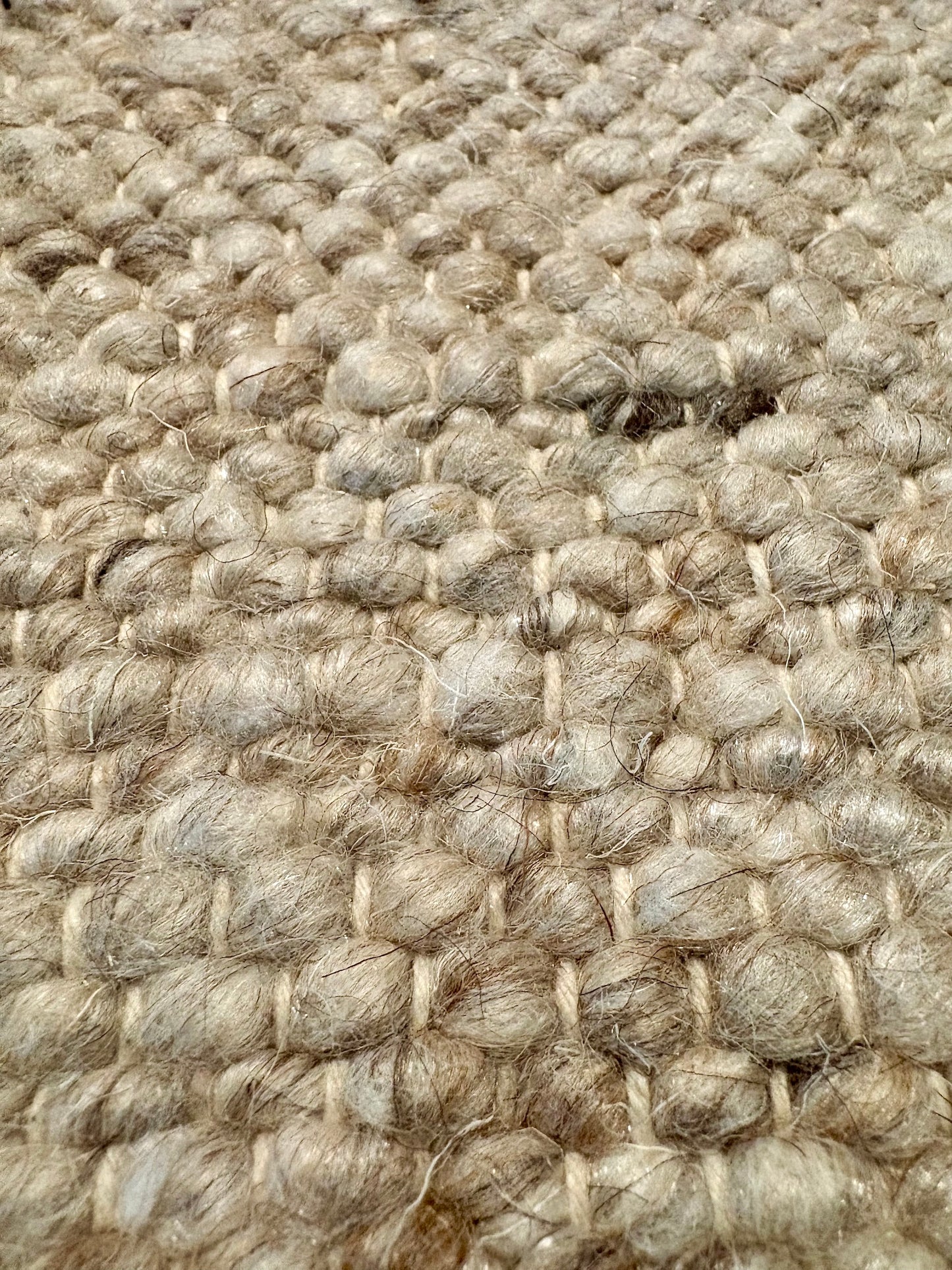 Harmony Beige Rug – hand-woven blend of wool and viscose in soft natural tones, featuring a textured finish that’s both elegant and durable. Colour White, Grey, black and brown flecks. 4 sizes. Super Close.