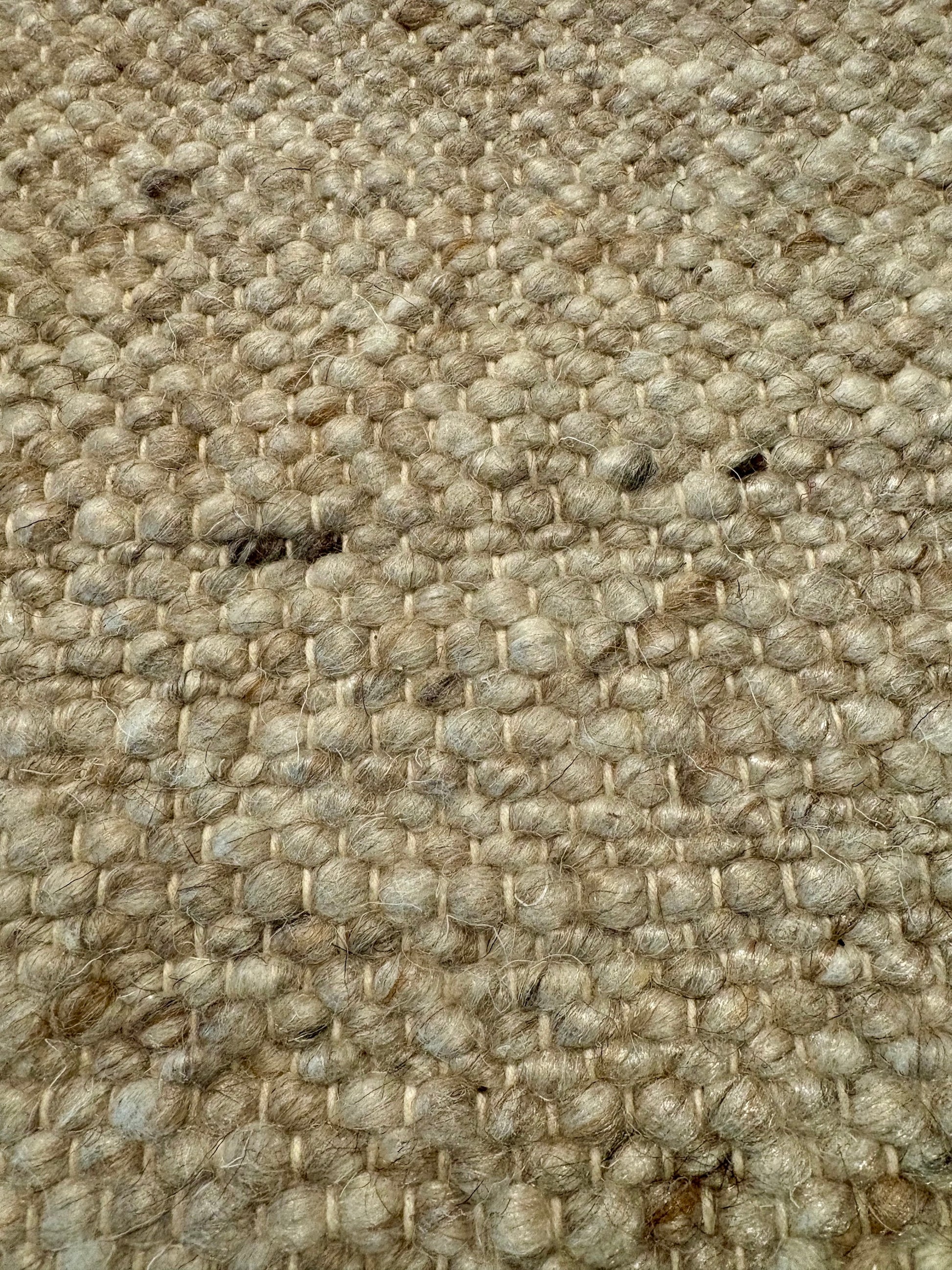 Harmony Beige Rug – hand-woven blend of wool and viscose in soft natural tones, featuring a textured finish that’s both elegant and durable. Colour White, Grey, black and brown flecks. 4 sizes. Close.