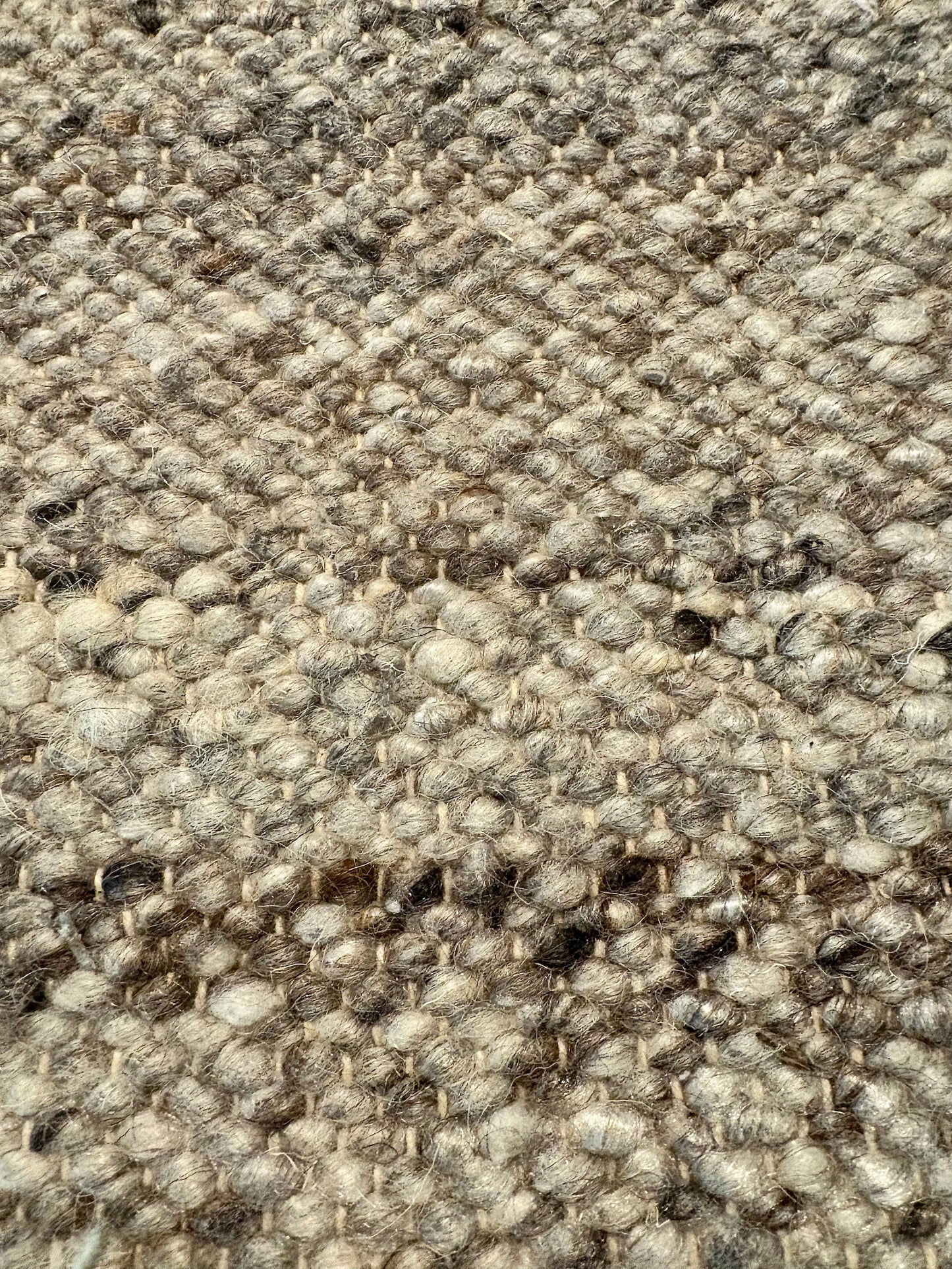 Harmony Dark Grey Rug – hand-woven blend of wool and viscose in soft natural tones, featuring a textured finish that’s both elegant and durable. Colour White, Grey, black and brown flecks. 3 sizes. Close.