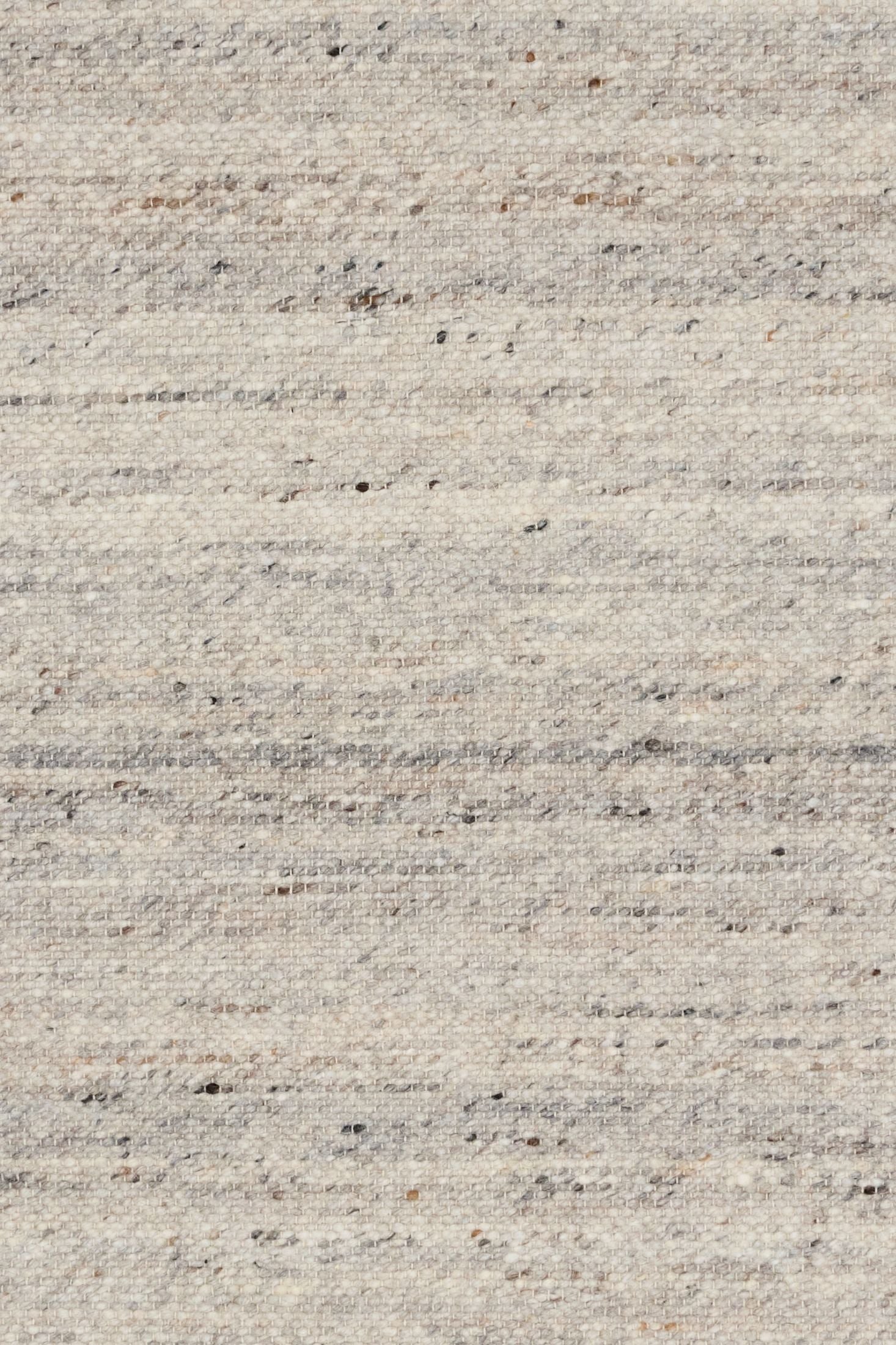 Harmony Smoke Grey Rug – hand-woven blend of wool and viscose in soft natural tones, featuring a textured finish that’s both elegant and durable. Colour White, Grey, black and brown flecks. 4 sizes. Close.