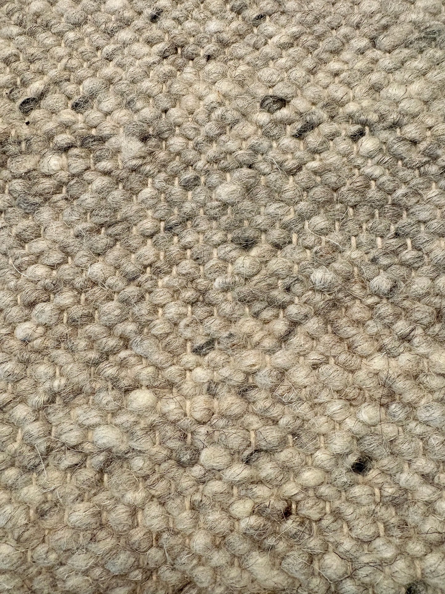 Harmony Smoke Grey Rug – hand-woven blend of wool and viscose in soft natural tones, featuring a textured finish that’s both elegant and durable. Colour White, Grey, black and brown flecks. 4 sizes. Up Close.