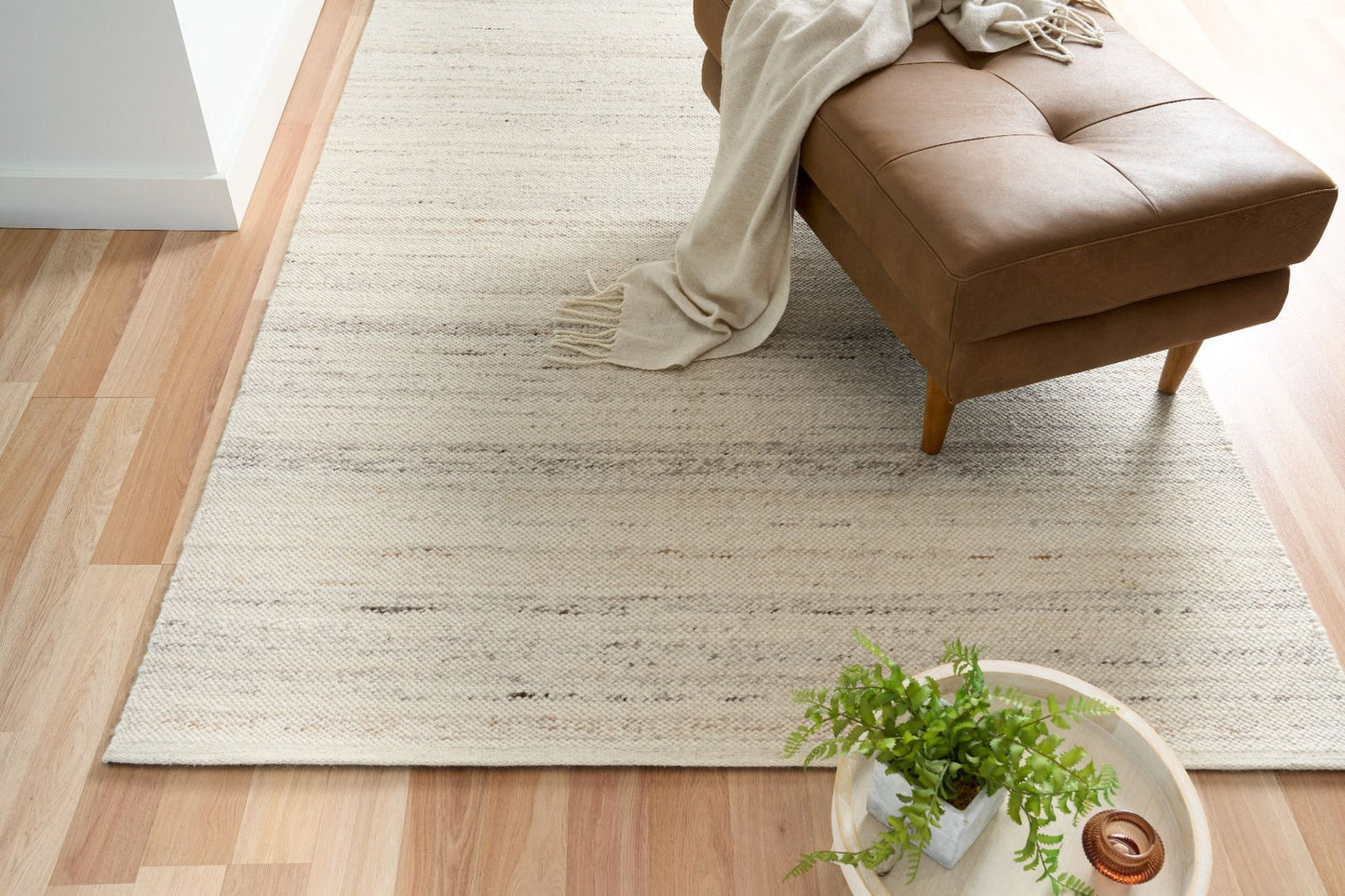 Harmony White Rug – hand-woven blend of wool and viscose in soft natural tones, featuring a textured finish that’s both elegant and durable. Colour White with black and brown fleck. 4 sizes. Life.