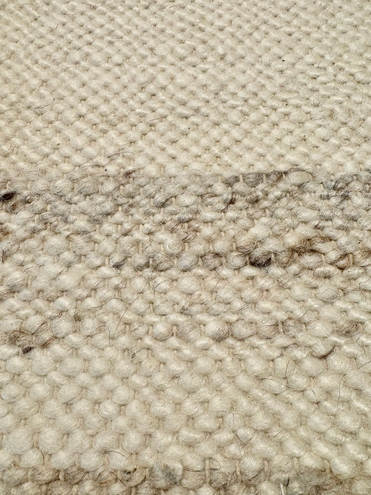 Harmony White Rug – hand-woven blend of wool and viscose in soft natural tones, featuring a textured finish that’s both elegant and durable. Colour White with black and brown fleck. 4 sizes. Close.