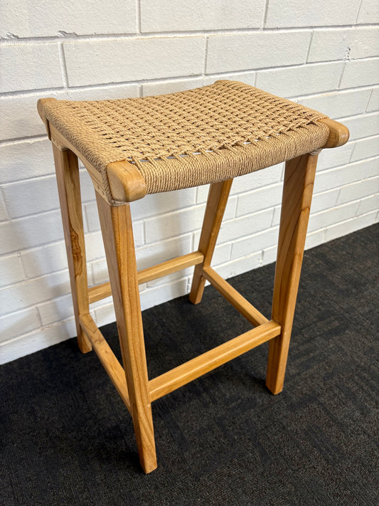 The Hudson Barstool boasts a coastal contemporary feel. Crafted from sustainable solid teak and featuring a luxurious rope seat. Colour natural. Measures 400 wide X 350 depth X 680 seat height. Angle.