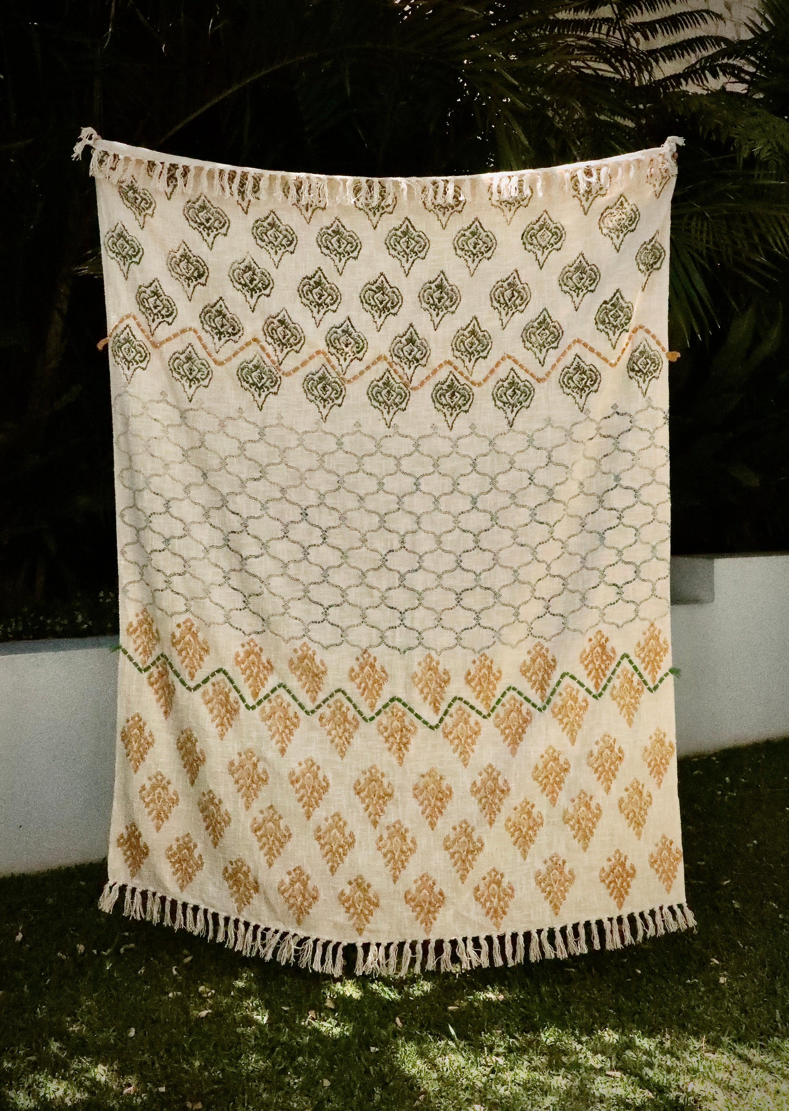 The Ikat Motif throw blanket is hand woven from soft and durable cotton slub.  Features a captivating Ikat Motif design and elegant tasseled ends. Colours beige, yellow, browns and light blues. Measures 130 X 170. Styled.