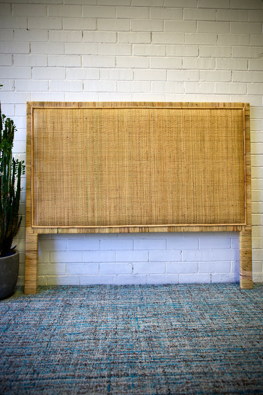 The Indian bedhead, crafted with finely-woven rattan. Available in queen and king sizes. Colour Natural. Front Styled.
