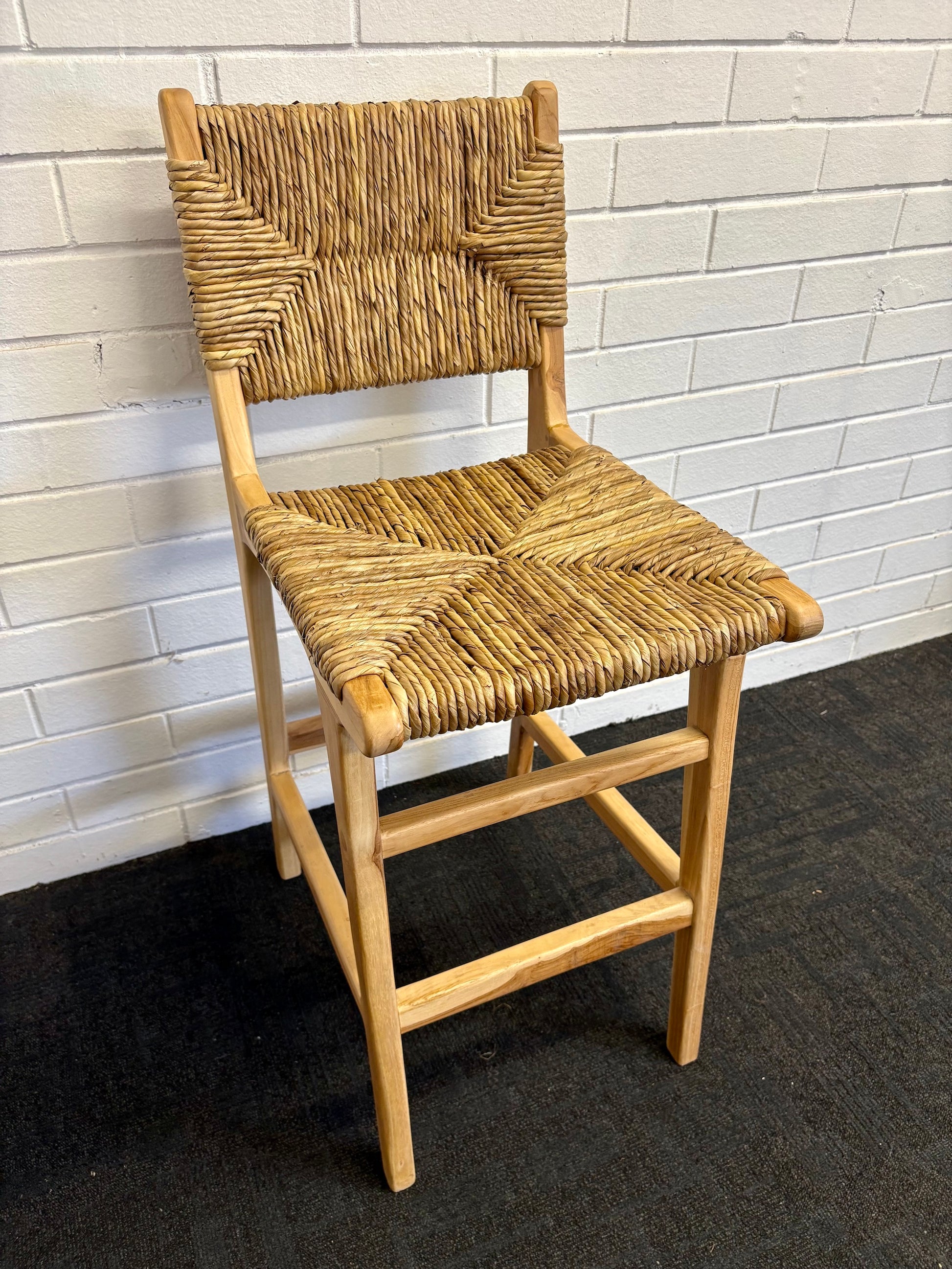 Indus with back barstool with solid teak wood frame and hand-woven natural pandan seat and back, featuring a clean, minimalist design suitable for coastal and contemporary interiors. Measures 410 Wide X 540 Depth X 670 Seat Height X 1000 Back Height. Angle.