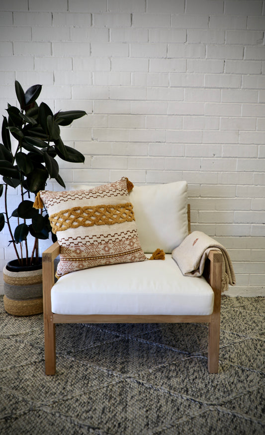 The Iris Occasional Chair is of a contemporary design, featuring a cushion back and seat, set upon a teak frame. Colours, natural frame with white cushions. Measures 750 wide X 850 depth X 650 height. Front Styled.