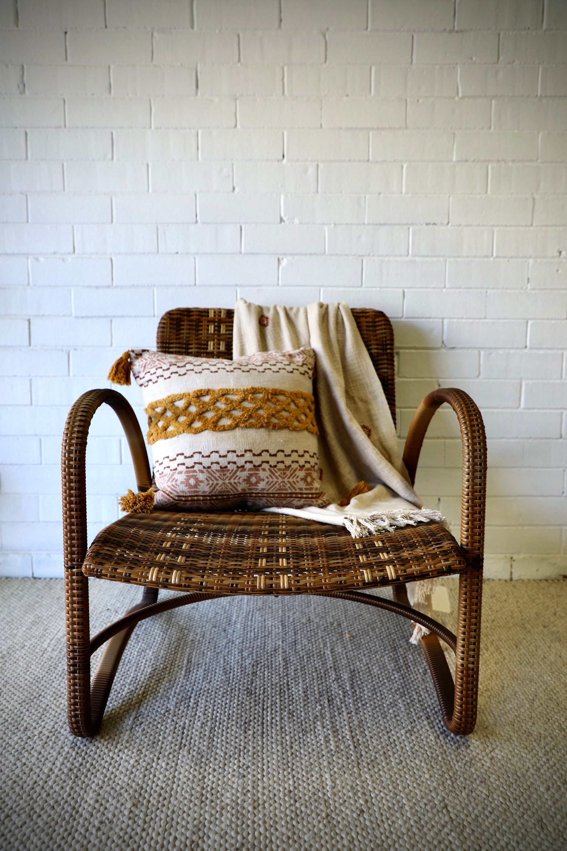 The Ivy Occasional Chair. With its coastal contemporary design, this occasional chair features a durable aluminium frame and synthetic rope weave. Colours, dark natural with a small blend of cream. Measures 720 wide X 800 height X 750 depth. Seat height 350. Arm height 640. Front Styled.