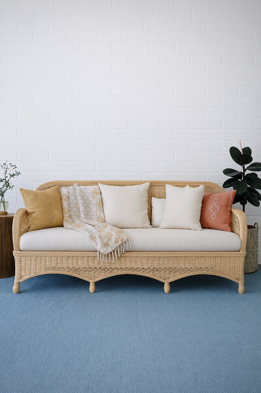 Kalahari Lounge, woven rattan sofa with UV resistant Cotton Twill seat and cushions. Measures 1950 wide X 600 Depth X 900 Height. Colour Natural rattan with white cushions. Styled. Ochoco Furniture Perth. Indoor-Outdoor Lounge Perth.