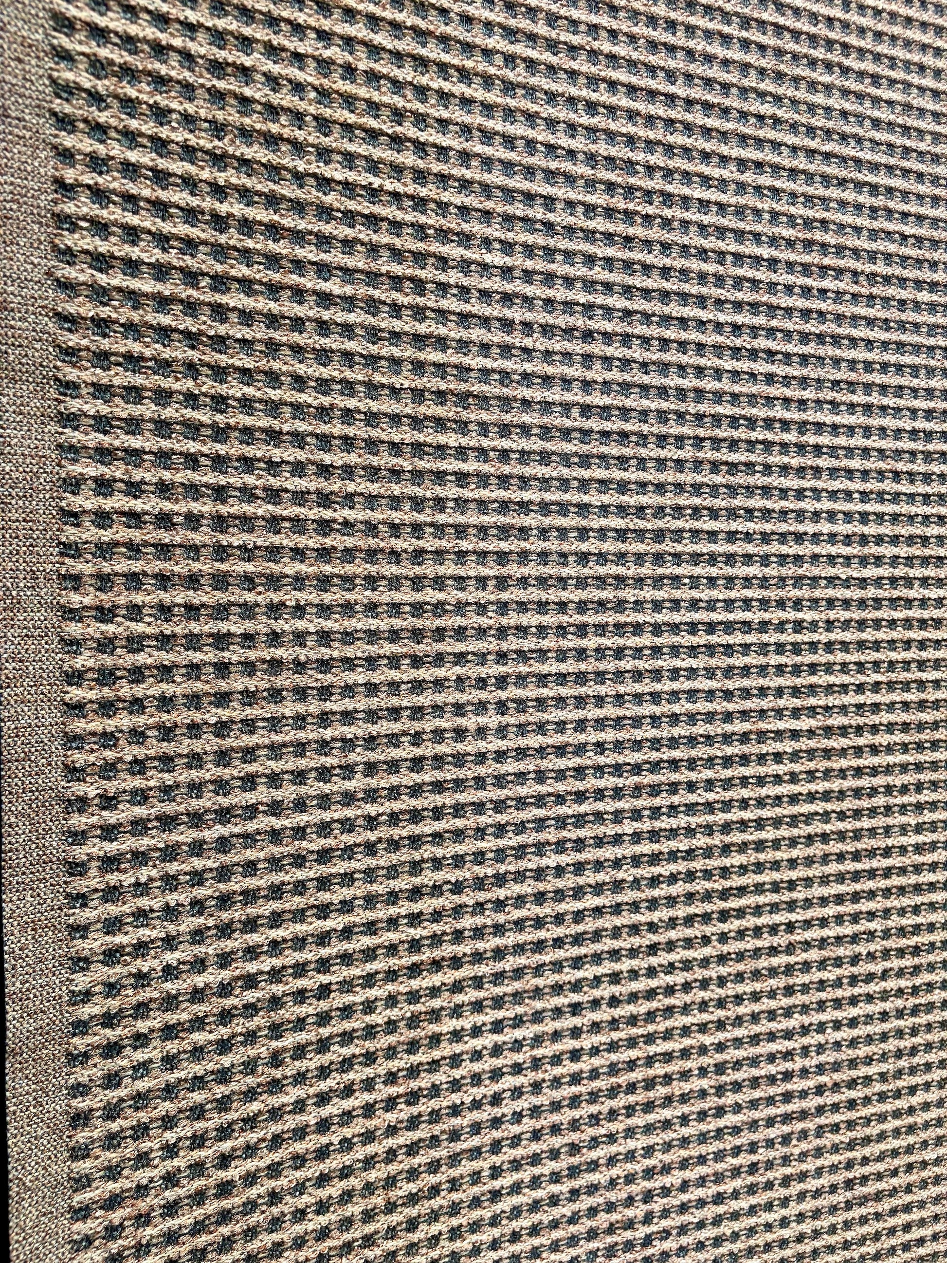 Katana Beige indoor/outdoor rug featuring Beige and light grey/gold tones and a subtle textured pattern, power-loomed from UV-stabilised polypropylene for lasting durability. Colour beige with grey and gold flecks. 3 sizes. Angle.