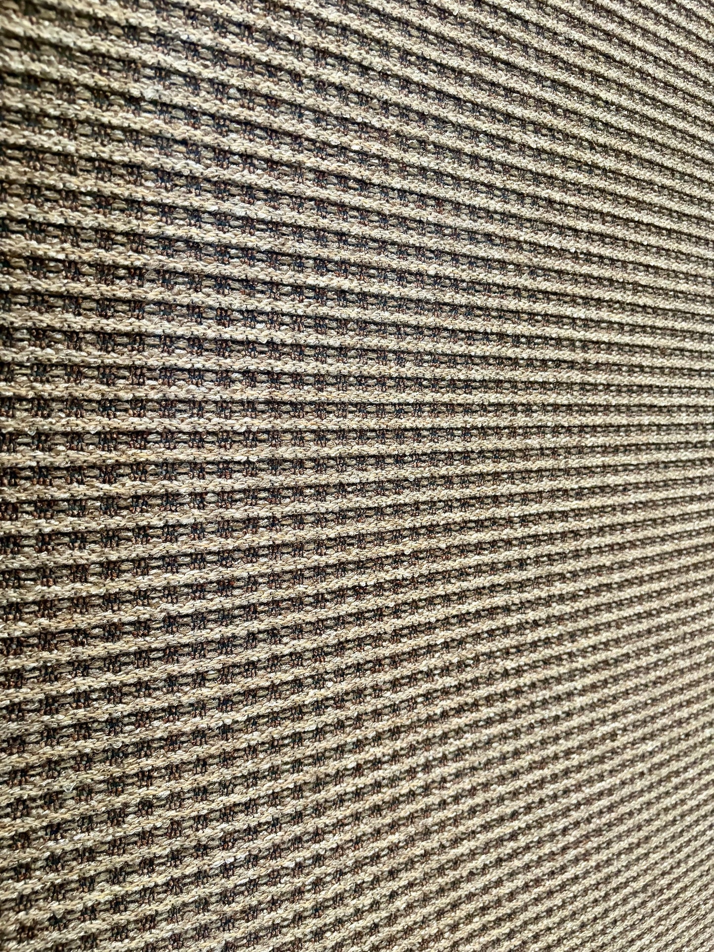 Katana Cream indoor/outdoor rug featuring soft cream and light grey tones and a subtle textured pattern, power-loomed from UV-stabilised polypropylene for lasting durability. Colour creams and light greys. 3 sizes. Angle.
