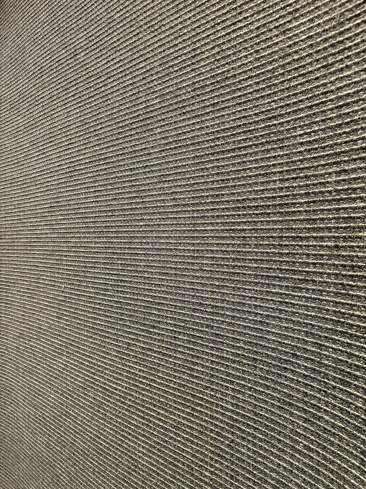 Katana Forest indoor/outdoor rug featuring deep green and light grey tones and a subtle textured pattern, power-loomed from UV-stabilised polypropylene for lasting durability. Colour forest green and light greys. 3 sizes. Angle 1.