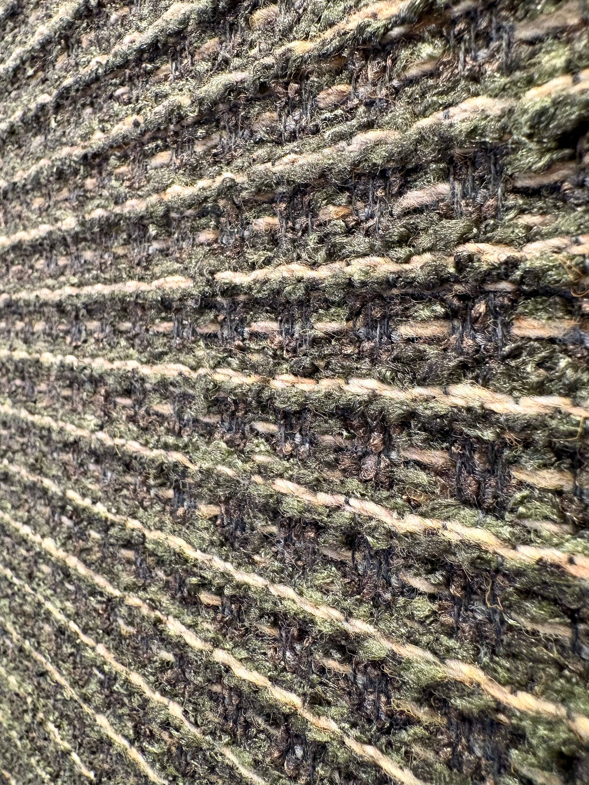 Katana Forest indoor/outdoor rug featuring deep green and light grey tones and a subtle textured pattern, power-loomed from UV-stabilised polypropylene for lasting durability. Colour forest green and light greys. 3 sizes. Close Angle.