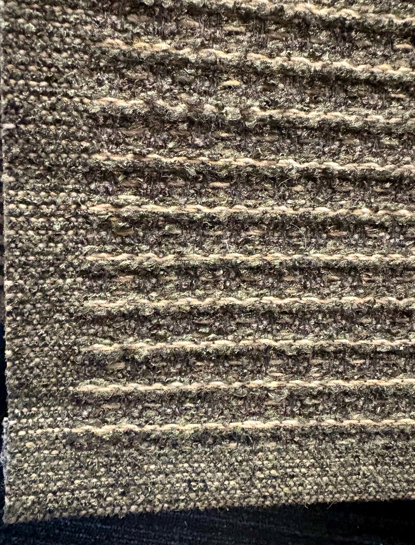 Katana Forest indoor/outdoor rug featuring deep green and light grey tones and a subtle textured pattern, power-loomed from UV-stabilised polypropylene for lasting durability. Colour forest green and light greys. 3 sizes. Corner.