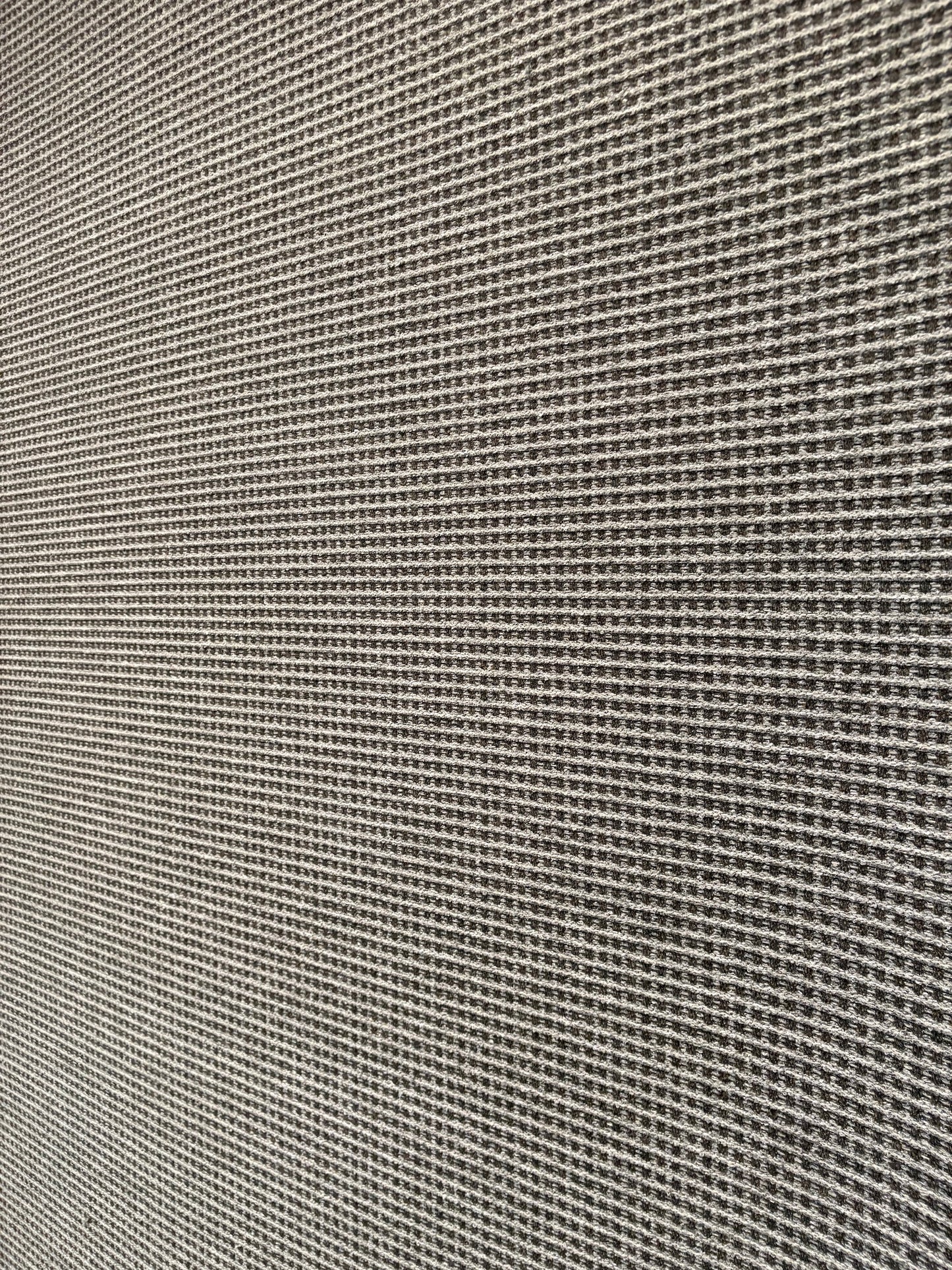 Katana Grey indoor/outdoor rug featuring a subtle textured pattern, power-loomed from UV-stabilised polypropylene for lasting durability. Colour grey. 3 sizes. Angle 1.