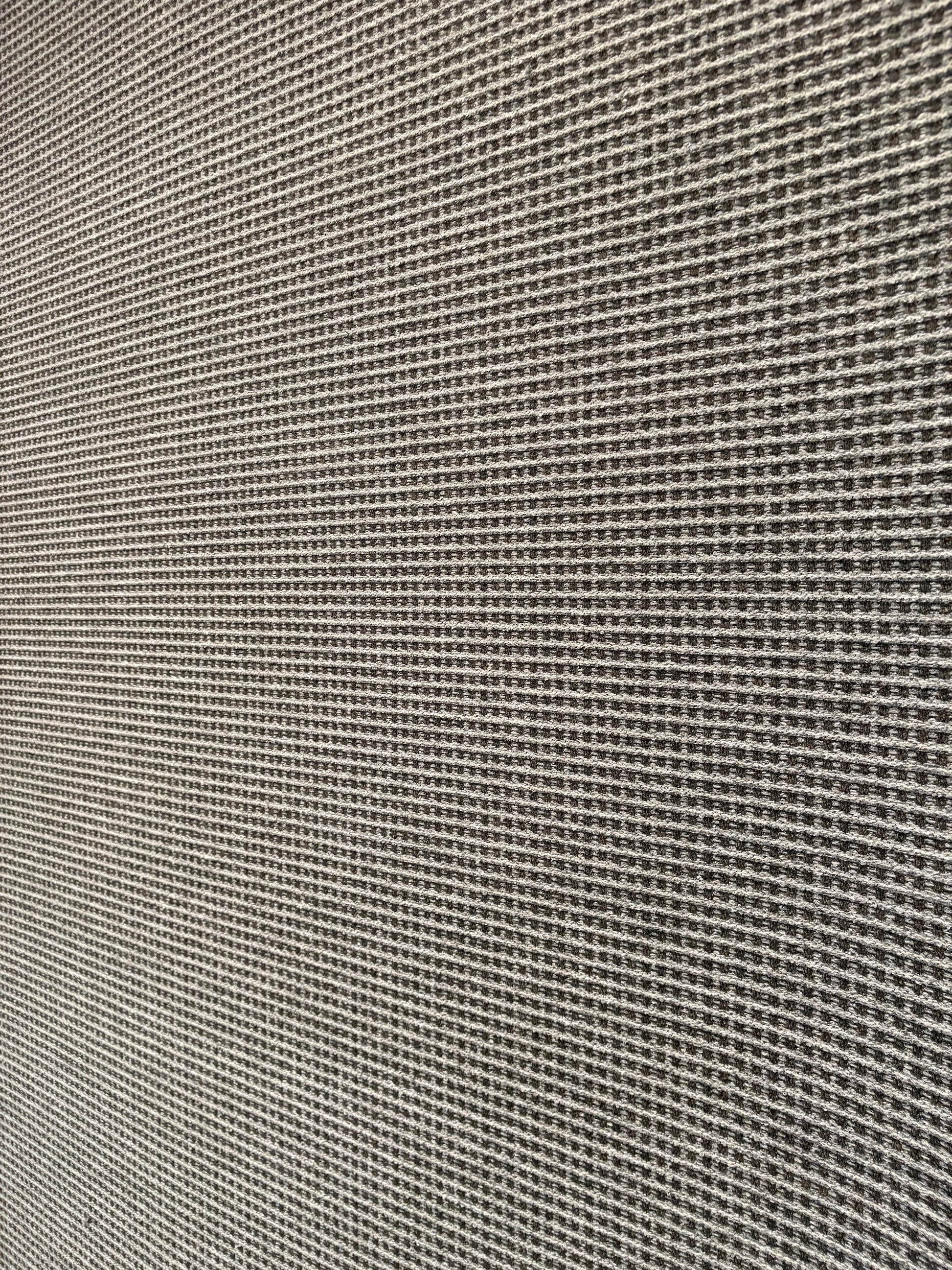 Katana Grey indoor/outdoor rug featuring a subtle textured pattern, power-loomed from UV-stabilised polypropylene for lasting durability. Colour grey. 3 sizes. Angle 1.