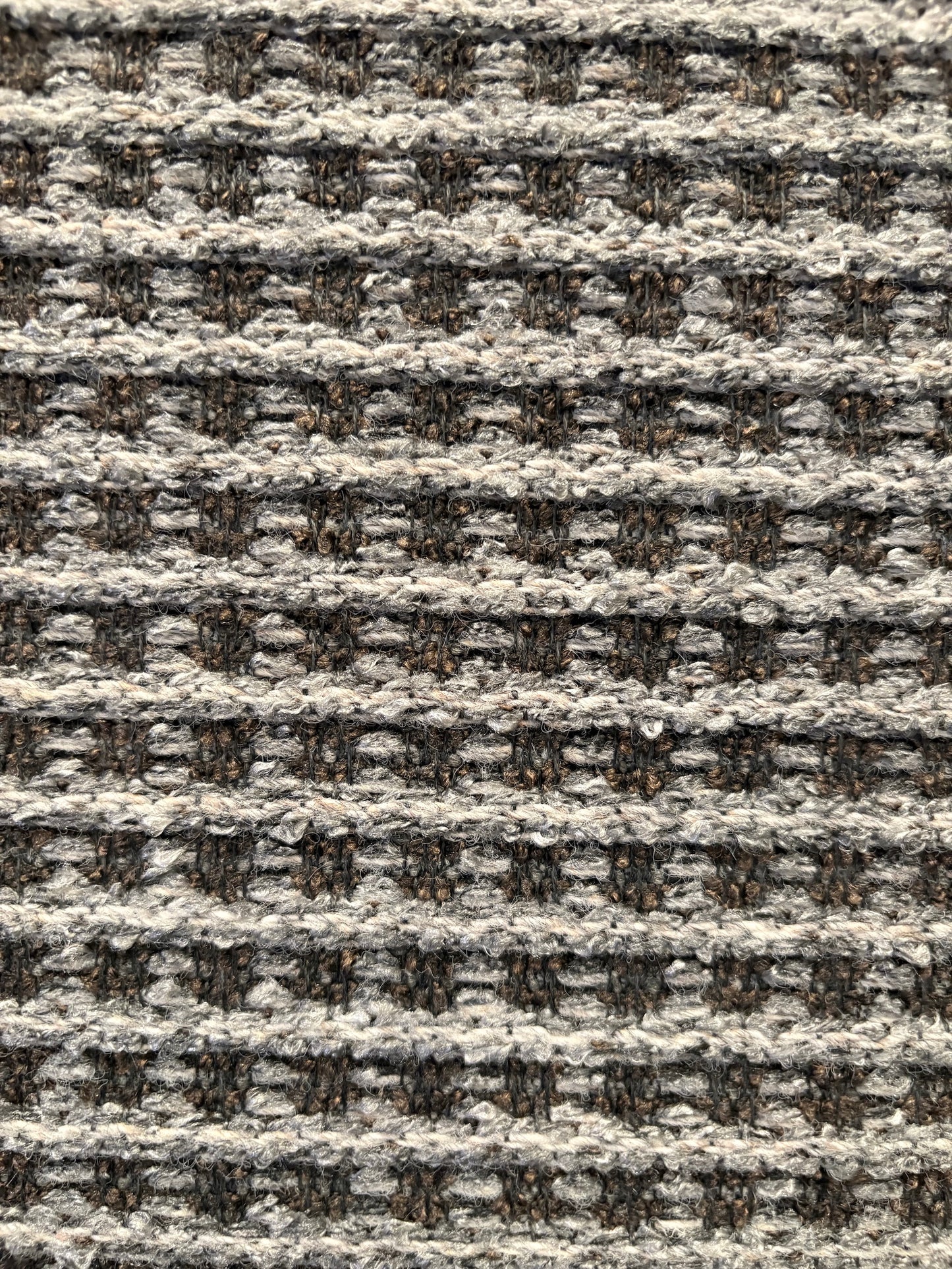 Katana Grey indoor/outdoor rug featuring a subtle textured pattern, power-loomed from UV-stabilised polypropylene for lasting durability. Colour grey. 3 sizes. Close.