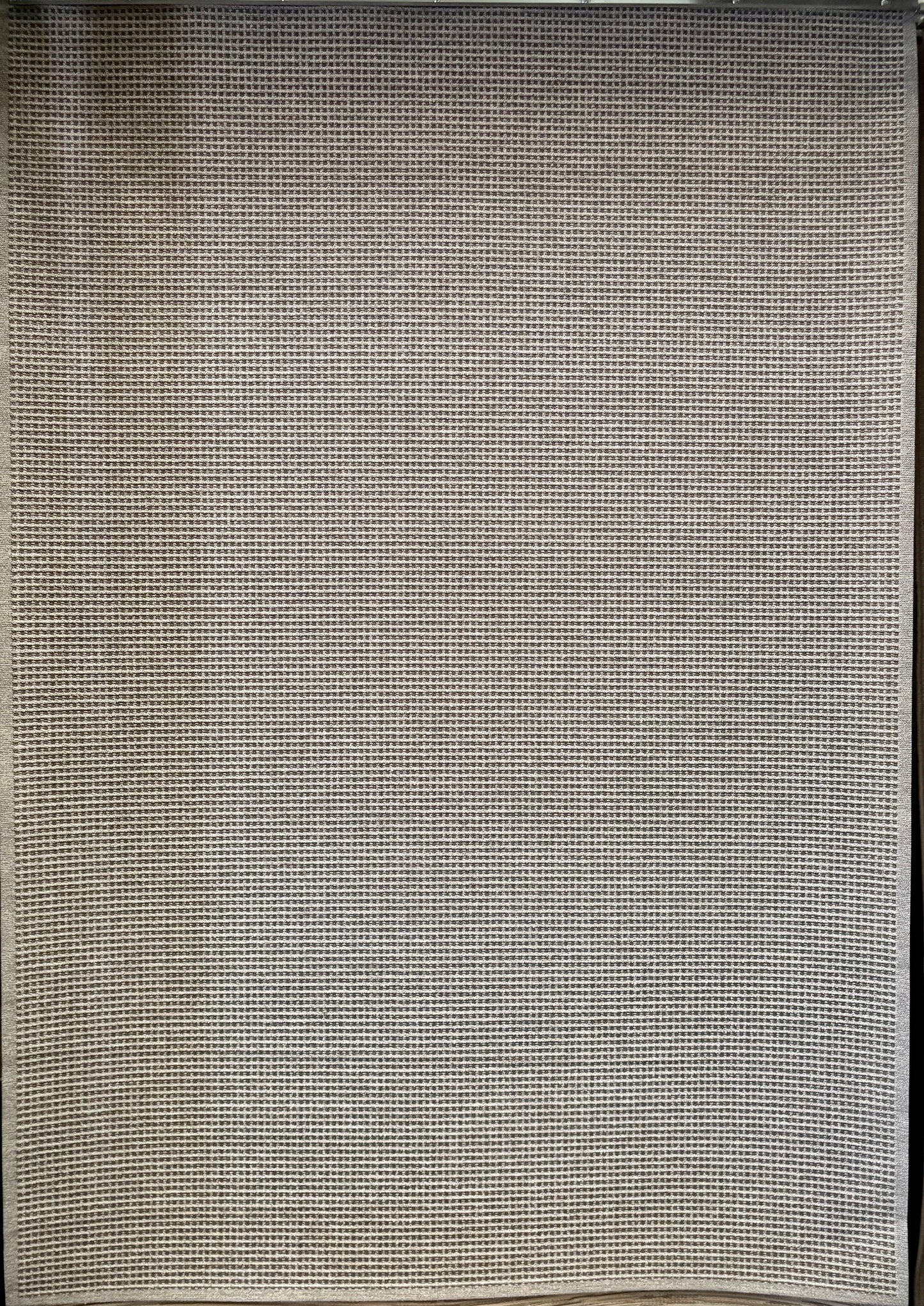 Katana Grey indoor/outdoor rug featuring a subtle textured pattern, power-loomed from UV-stabilised polypropylene for lasting durability. Colour grey. 3 sizes. Full.