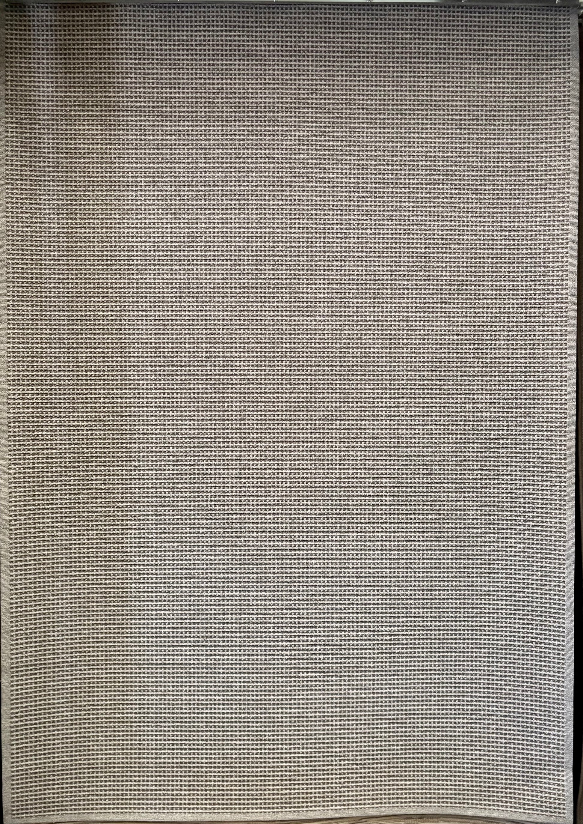 Katana Grey indoor/outdoor rug featuring a subtle textured pattern, power-loomed from UV-stabilised polypropylene for lasting durability. Colour grey. 3 sizes. Full.