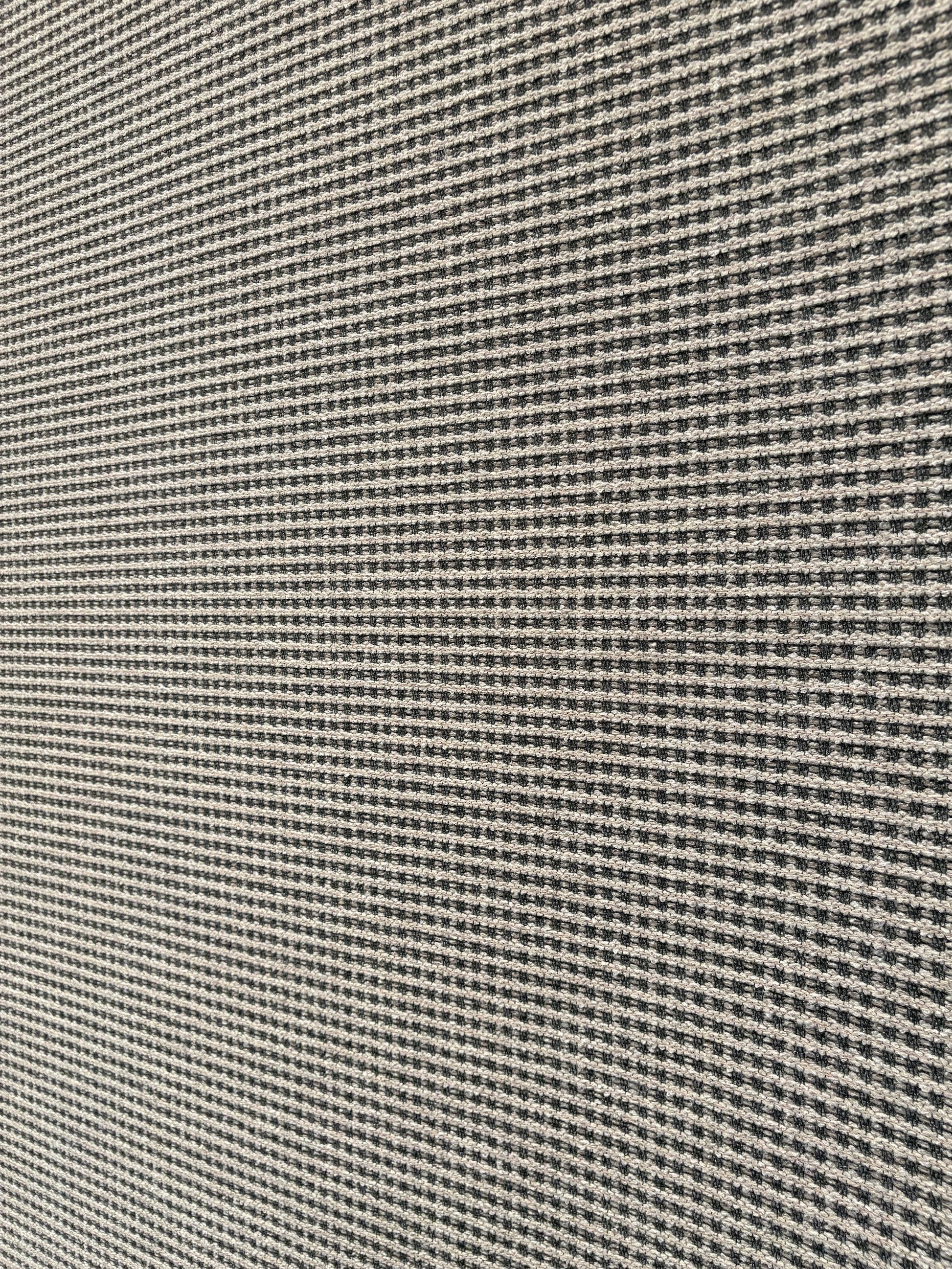 Katana Light Grey indoor/outdoor rug featuring light grey/grey tones and a subtle textured pattern, power-loomed from UV-stabilised polypropylene for lasting durability. Colour light grey. 3 sizes. Angle 1.