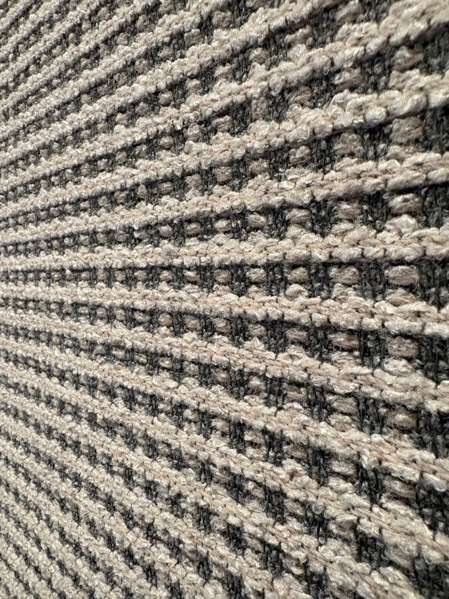 Katana Light Grey indoor/outdoor rug featuring light grey/grey tones and a subtle textured pattern, power-loomed from UV-stabilised polypropylene for lasting durability. Colour light grey. 3 sizes. Close Angle.