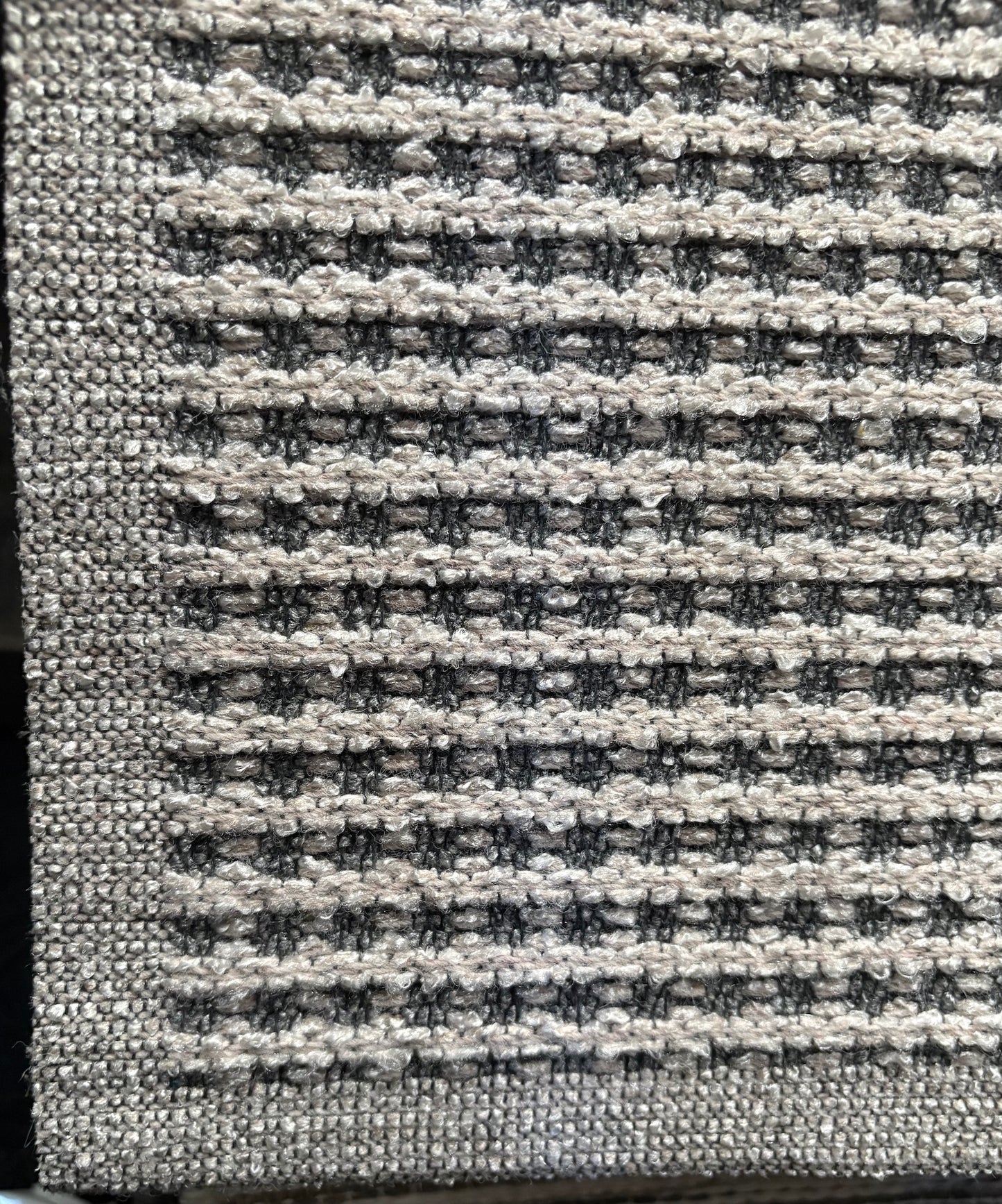 Katana Light Grey indoor/outdoor rug featuring light grey/grey tones and a subtle textured pattern, power-loomed from UV-stabilised polypropylene for lasting durability. Colour light grey. 3 sizes. Corner.