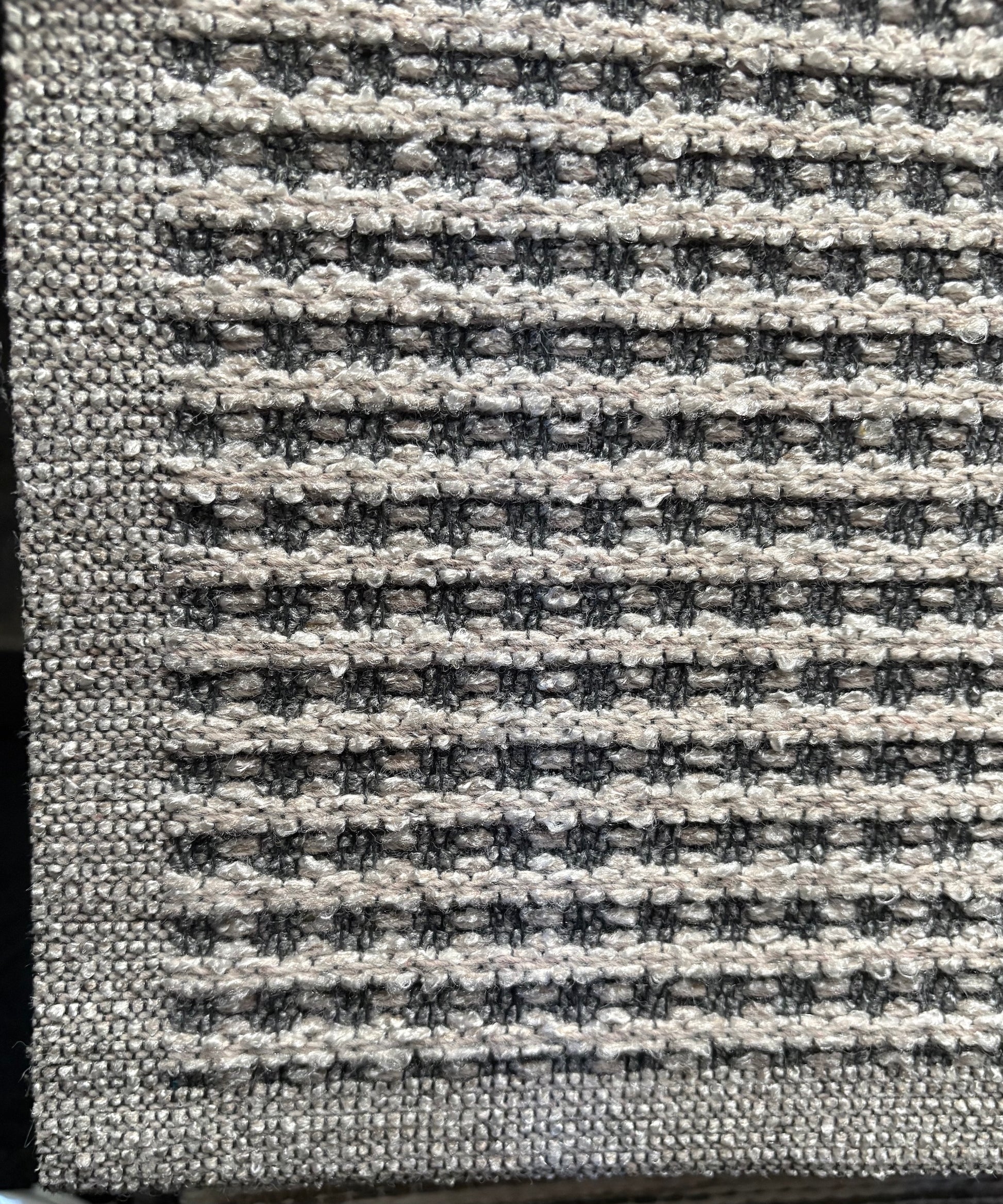 Katana Light Grey indoor/outdoor rug featuring light grey/grey tones and a subtle textured pattern, power-loomed from UV-stabilised polypropylene for lasting durability. Colour light grey. 3 sizes. Corner.