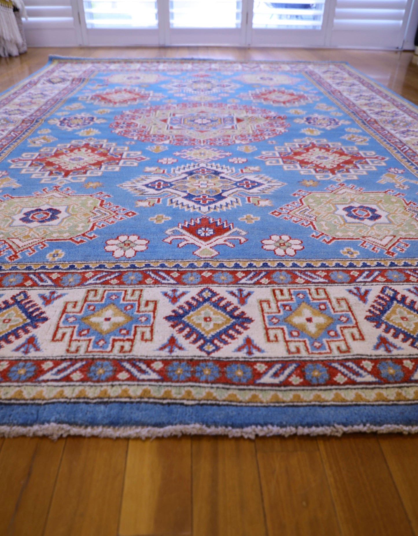 The Hand Knotted Kazak Rug 203 X 298. This wool rug combines superior durability with a traditional flair. 100% hand knotted wool. Measures 203 wide X 298 Length. Ochoco Hand Knotted Rugs Perth. Angle.