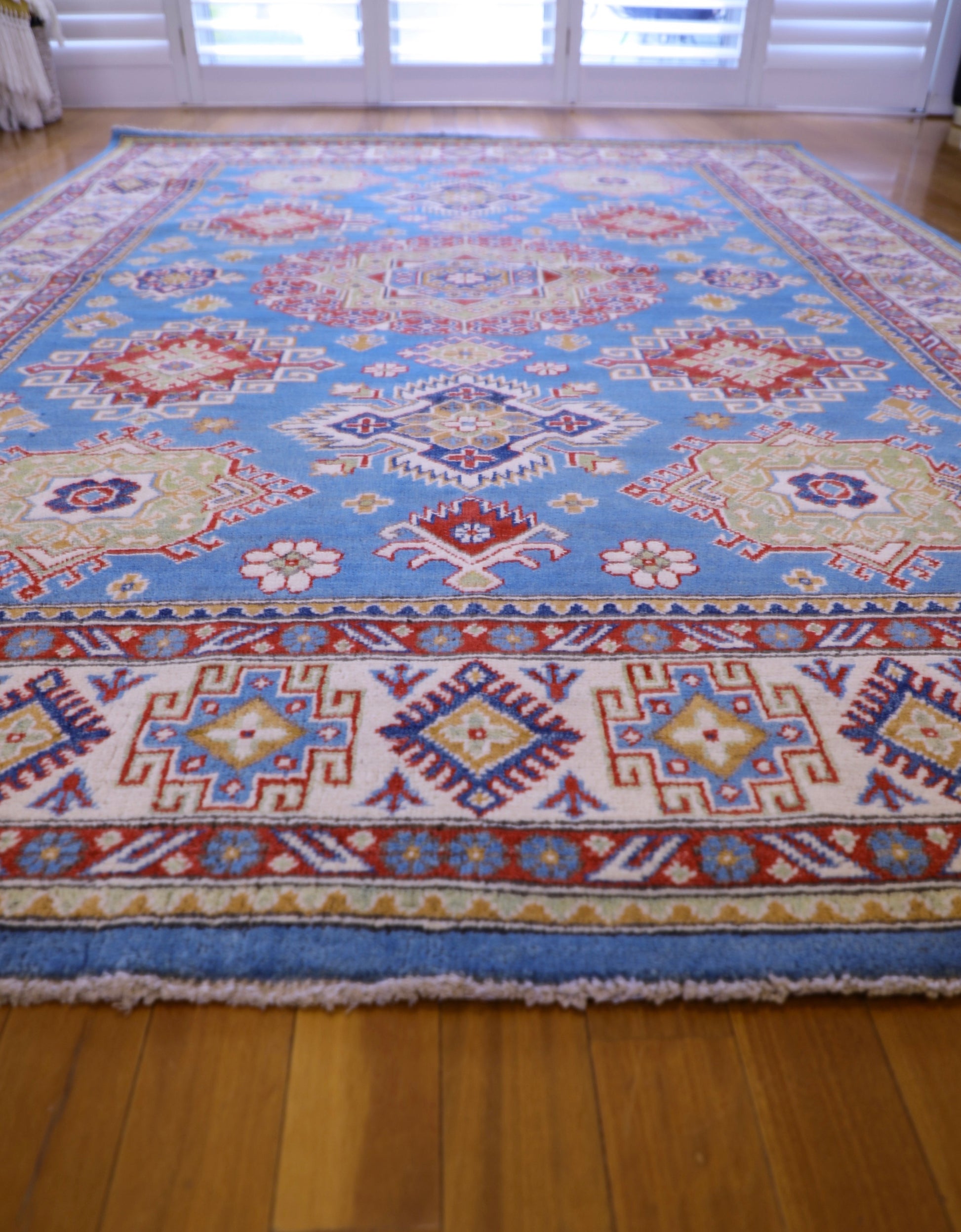 The Hand Knotted Kazak Rug 203 X 298. This wool rug combines superior durability with a traditional flair. 100% hand knotted wool. Measures 203 wide X 298 Length. Ochoco Hand Knotted Rugs Perth. Angle.