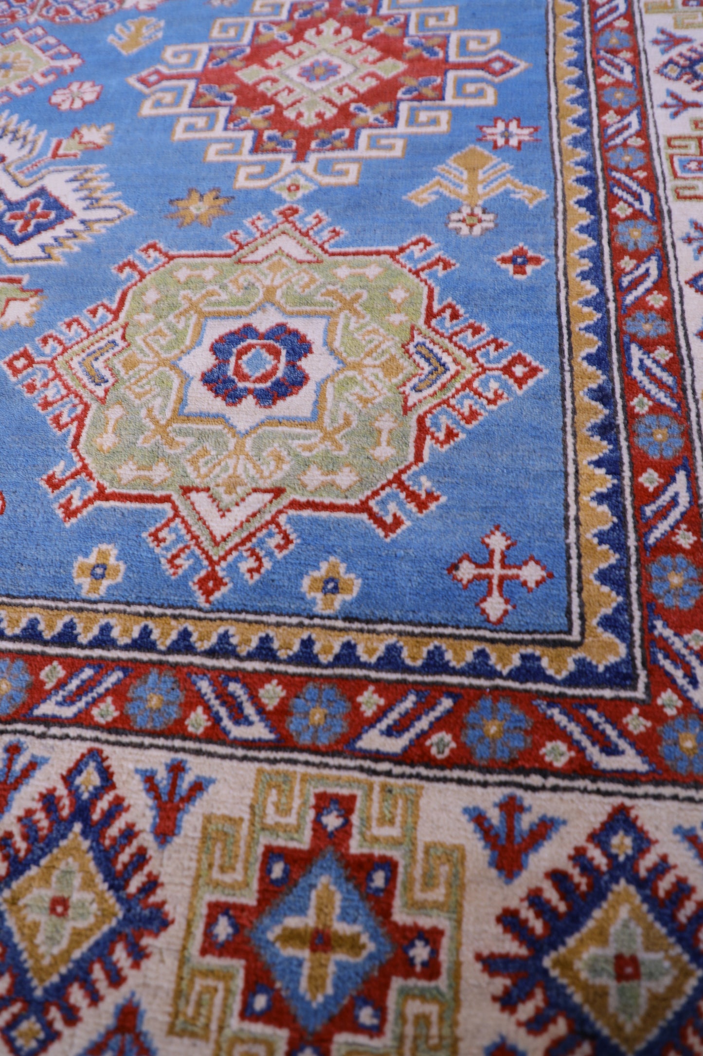 The Hand Knotted Kazak Rug 203 X 298. This wool rug combines superior durability with a traditional flair. 100% hand knotted wool. Measures 203 wide X 298 Length. Ochoco Hand Knotted Rugs Perth. Close.
