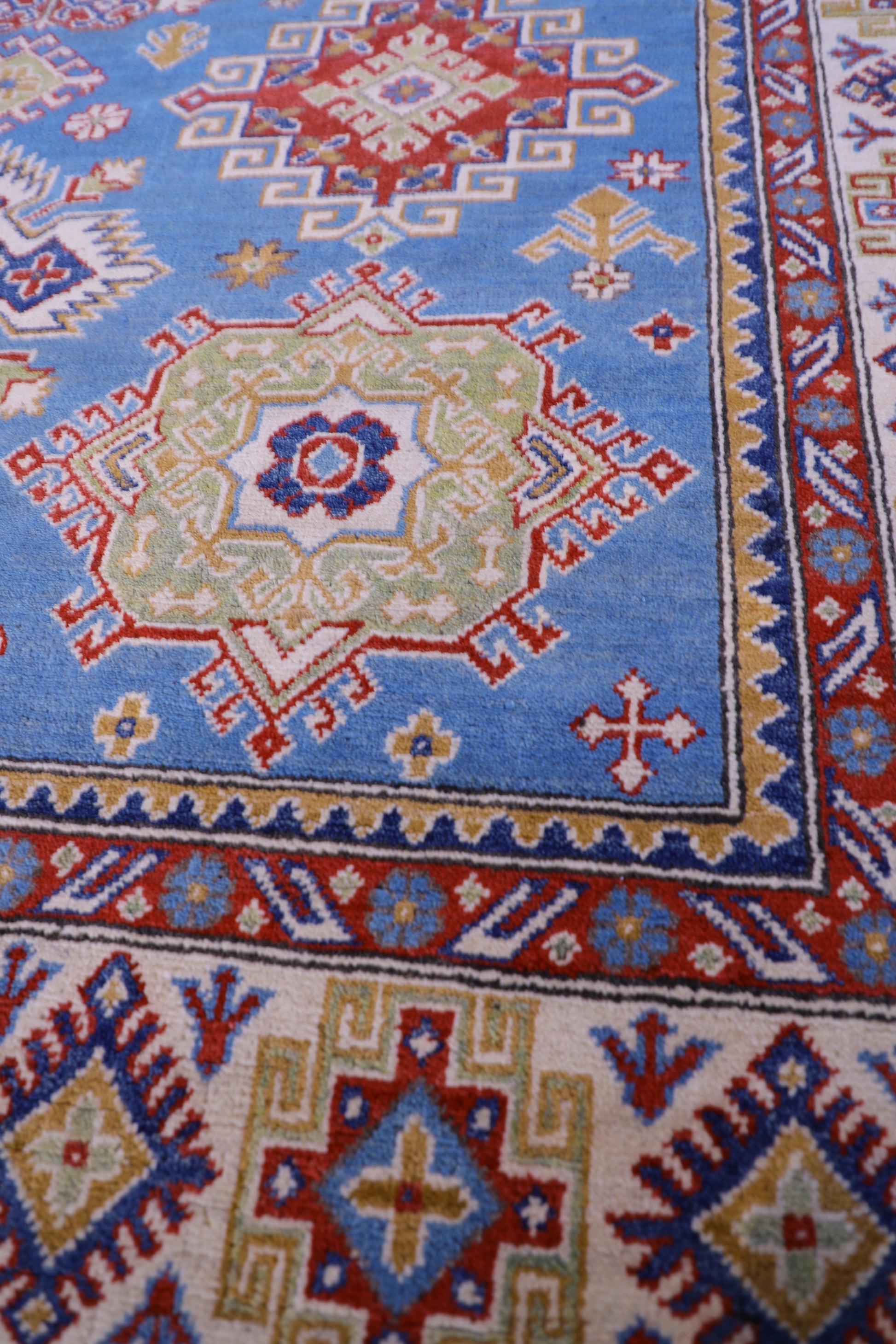 The Hand Knotted Kazak Rug 203 X 298. This wool rug combines superior durability with a traditional flair. 100% hand knotted wool. Measures 203 wide X 298 Length. Ochoco Hand Knotted Rugs Perth. Close.