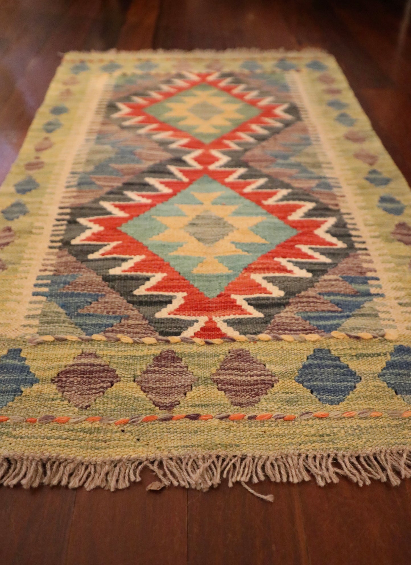  The Afghan Hand Woven Khyber Kilim - 59 X 90. Crafted using traditional vegetable dyed wool, and featuring traditional geometric designs. Colours, beiges, blues, creams, light greens, light blues and yellows. Size 59 X 90. Angle.