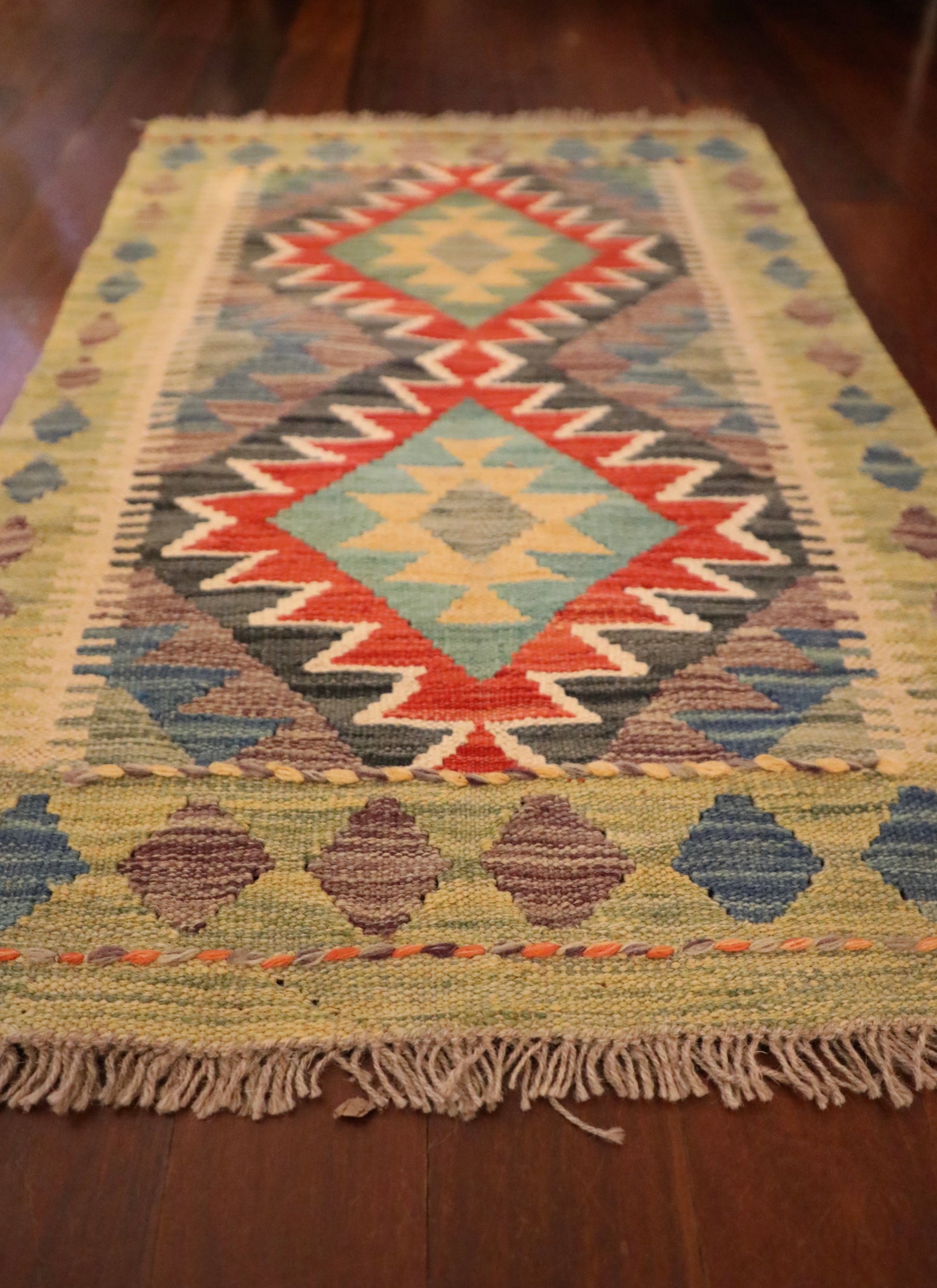  The Afghan Hand Woven Khyber Kilim - 59 X 90. Crafted using traditional vegetable dyed wool, and featuring traditional geometric designs. Colours, beiges, blues, creams, light greens, light blues and yellows. Size 59 X 90. Angle.