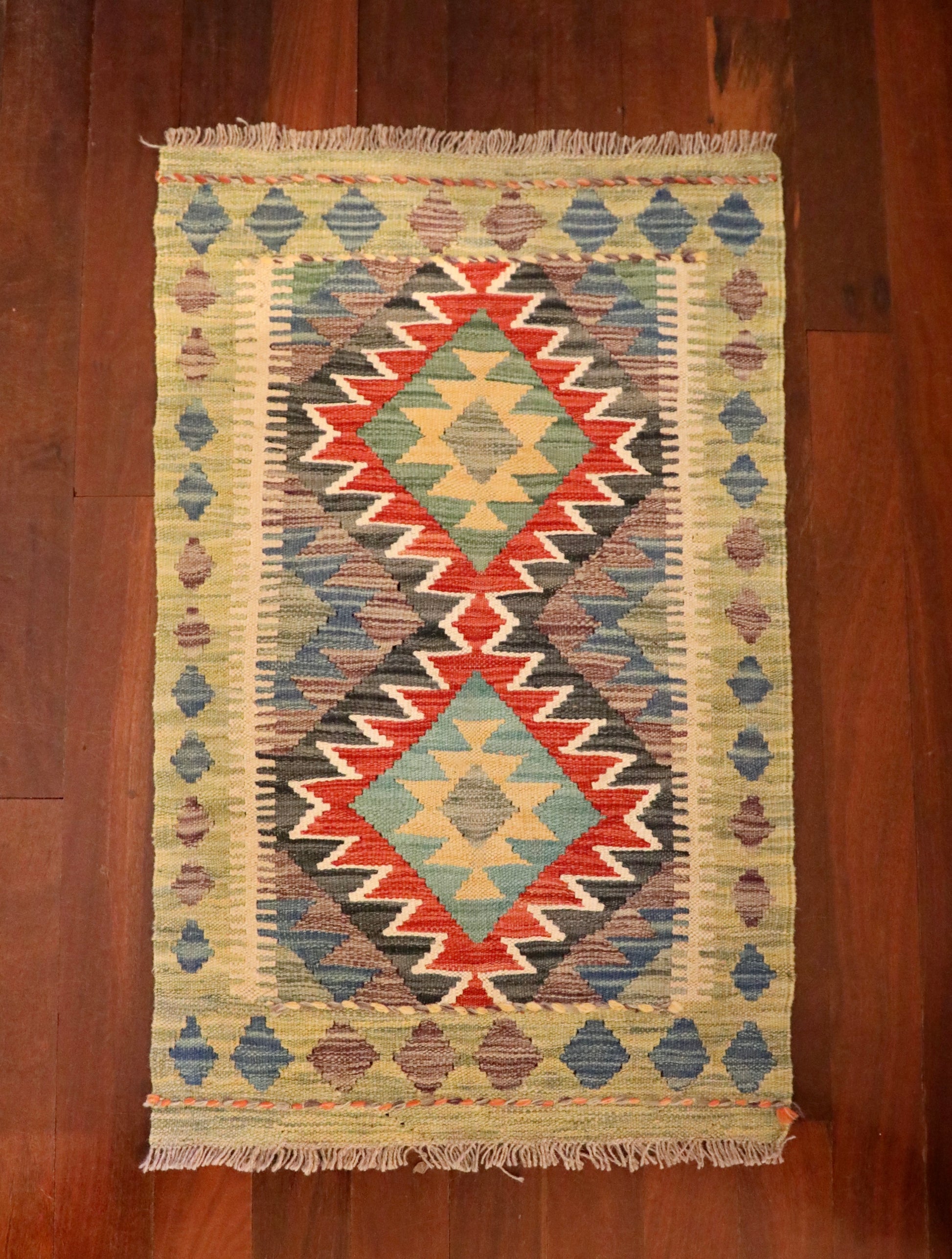 The Afghan Hand Woven Khyber Kilim - 59 X 90. Crafted using traditional vegetable dyed wool, and featuring traditional geometric designs. Colours, beiges, blues, creams, light greens, light blues and yellows. Size 59 X 90. Top.