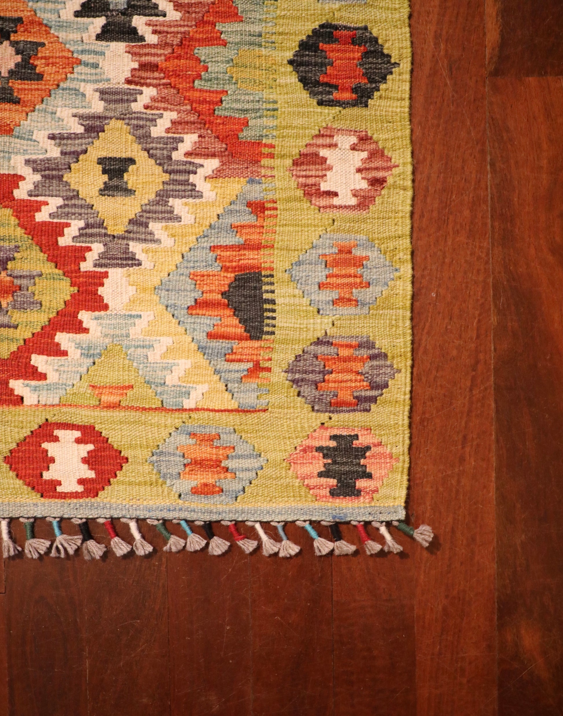 The Afghan Hand Woven Khyber Kilim Runner - 86 X 290.  Crafted using traditional vegetable dyed wool, and featuring traditional geometric designs. Colours, yellows, creams, beiges, oranges, blues and more. Measures 86 wide X 290 long. Corner.